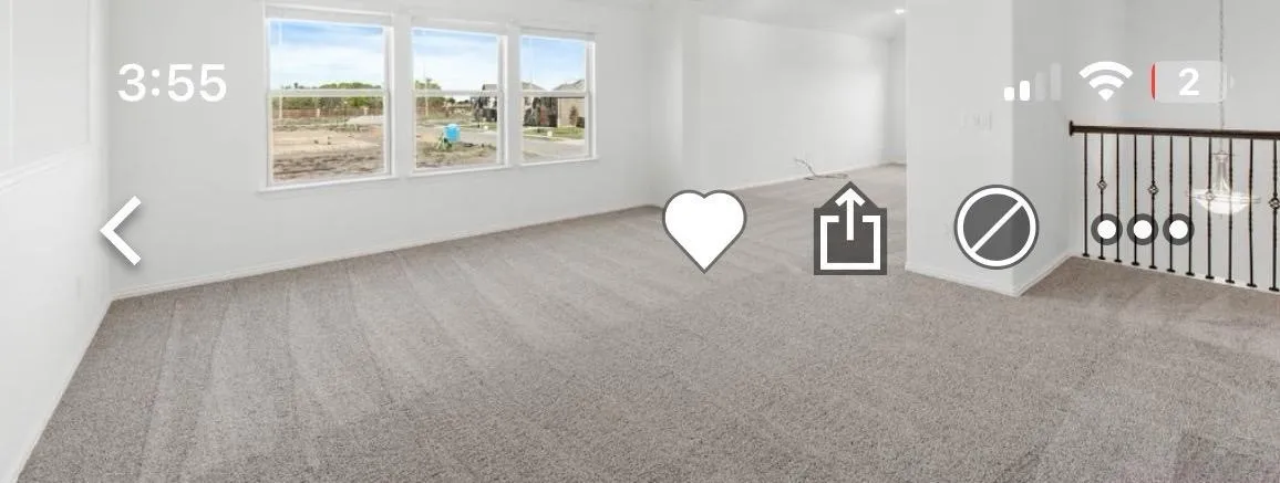 Empty room with carpet floors and baseboards
