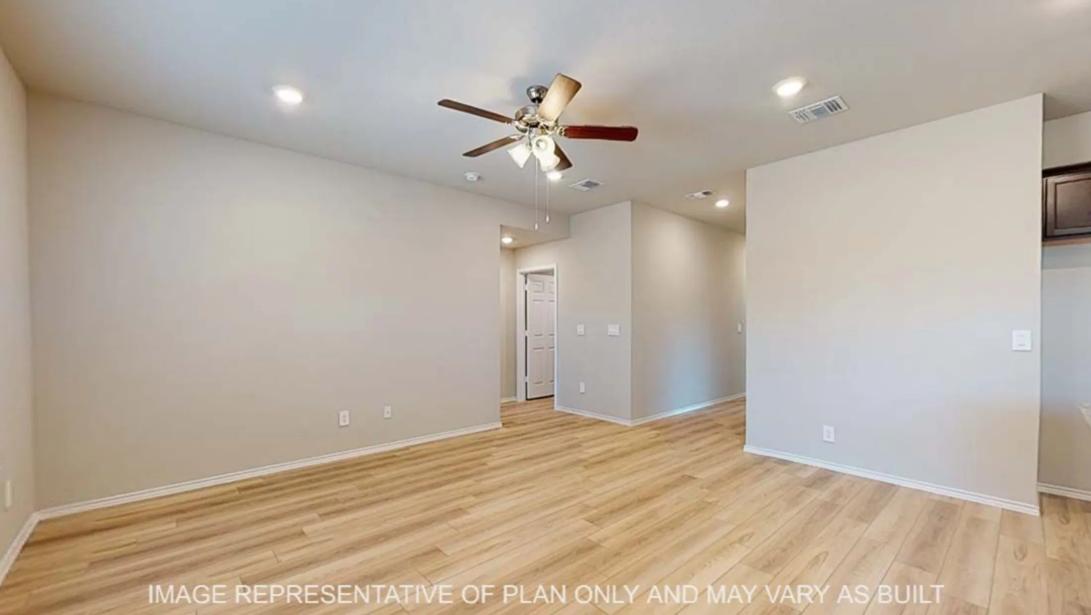 Wood-finish flooring, recessed lighting, and a ceiling fan with integrated lighting