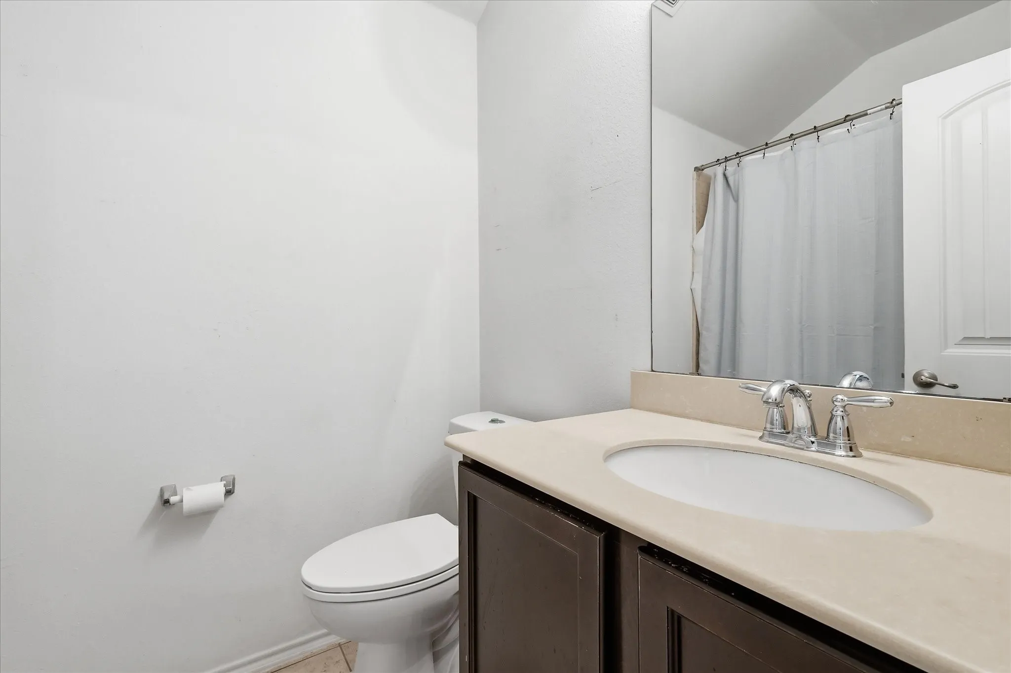 2nd bath with good sized vanity, and can see the shower in background.