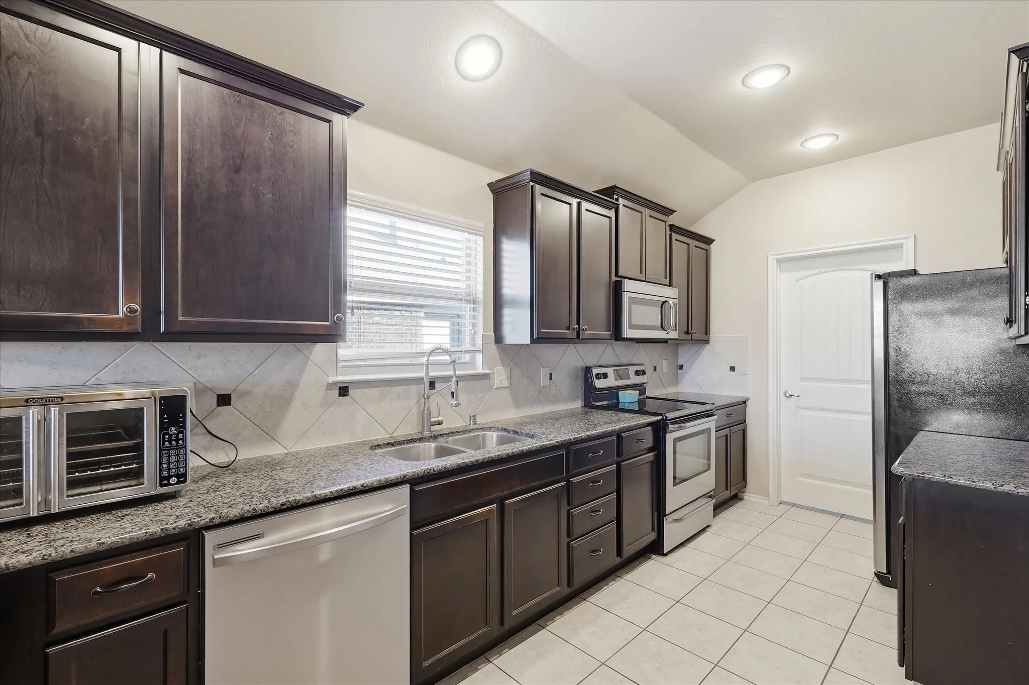 New dishwasher, stainless steel appliances.  Double sink and LOTS of counterspace and storage.