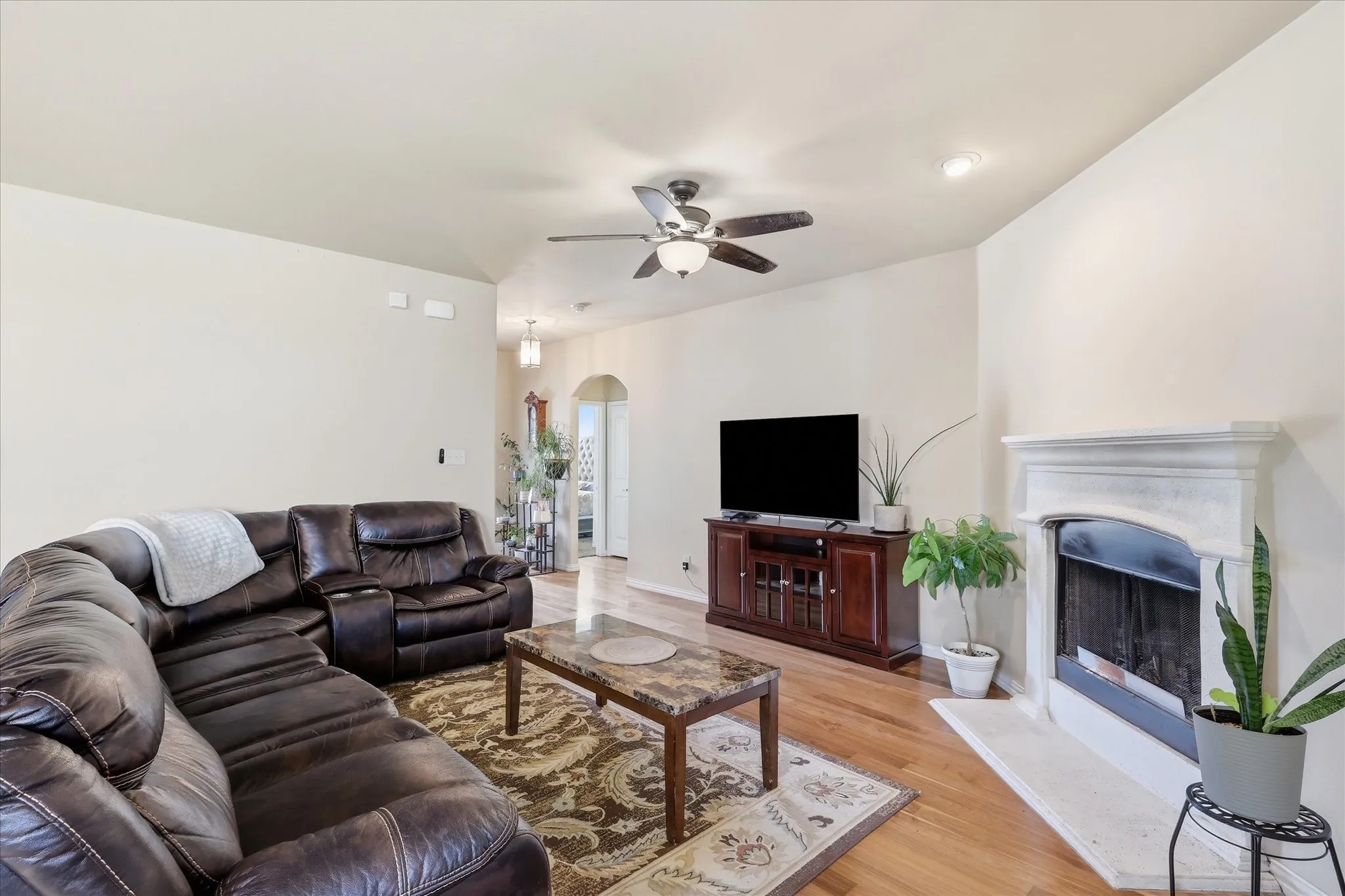 View back toward entry, with upper left hallway having 2 bedrooms.  Floorplan at end of photo carousel.