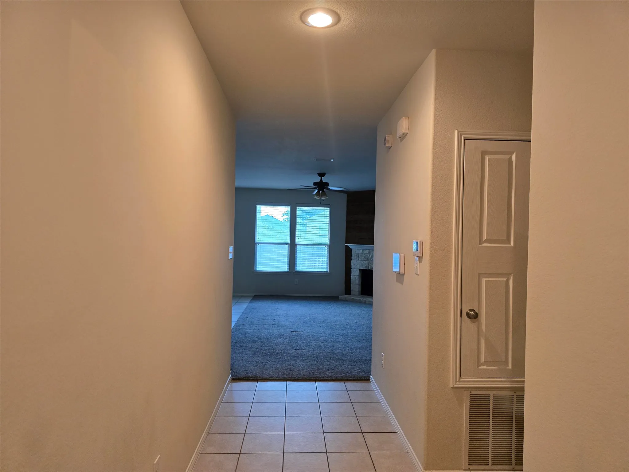 Tiled entryway with recessed lighting