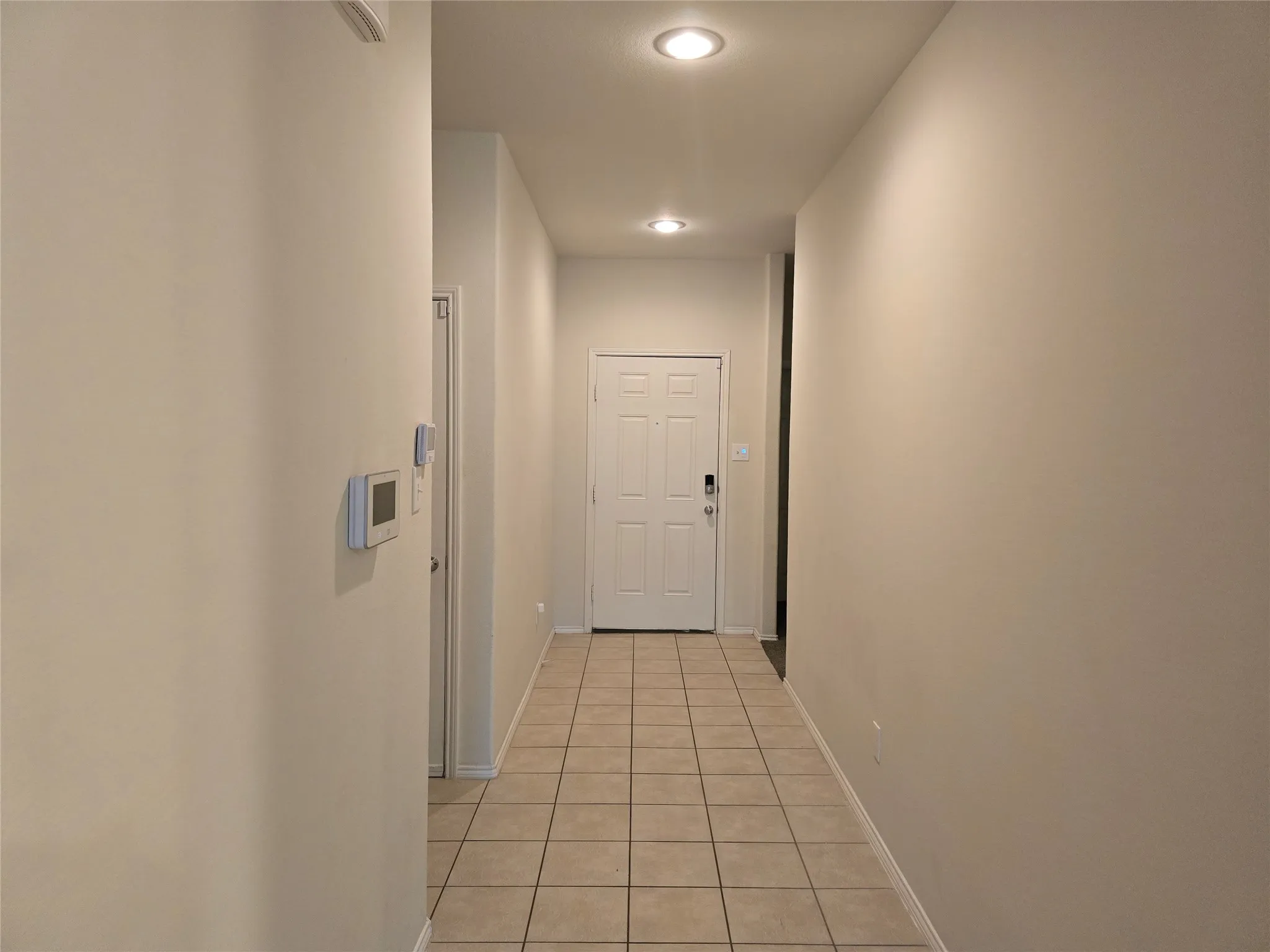 Recessed ceiling lighting illuminating tile flooring
