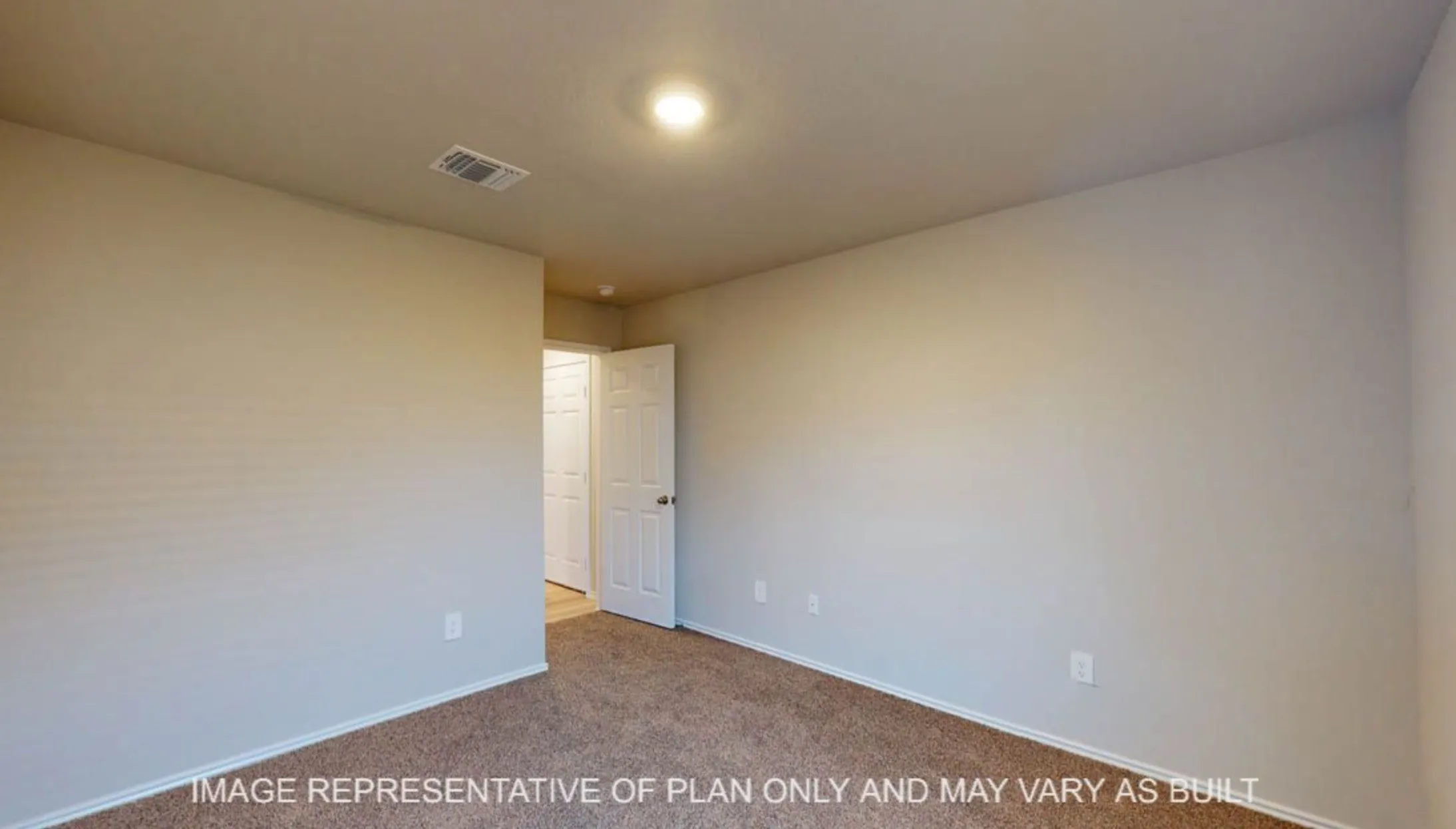 Neutral wall paint, plush carpet flooring, recessed lighting, and a white interior door with a round handle