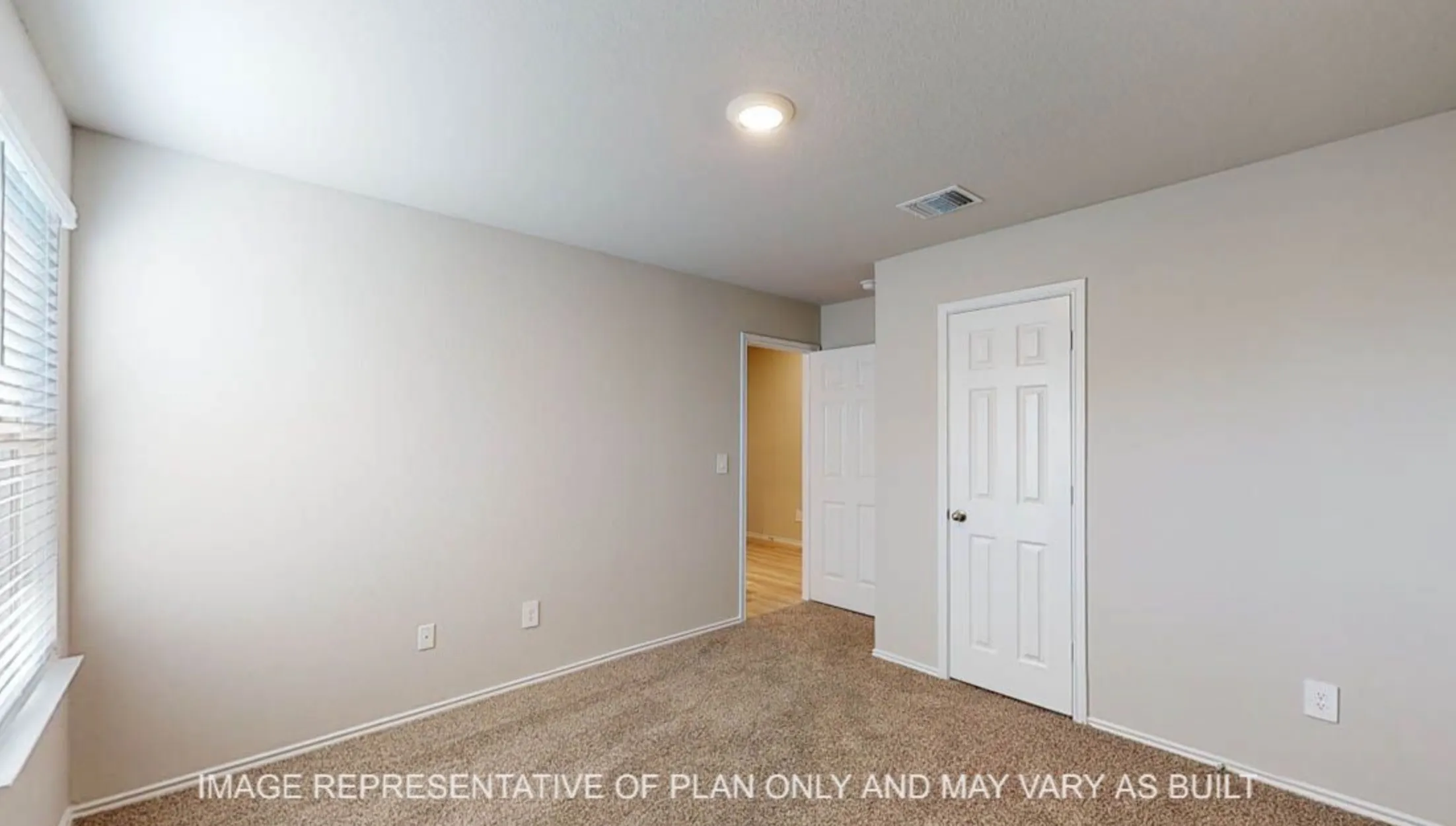 Carpeted flooring, recessed ceiling lighting, light gray wall paint, and white trim