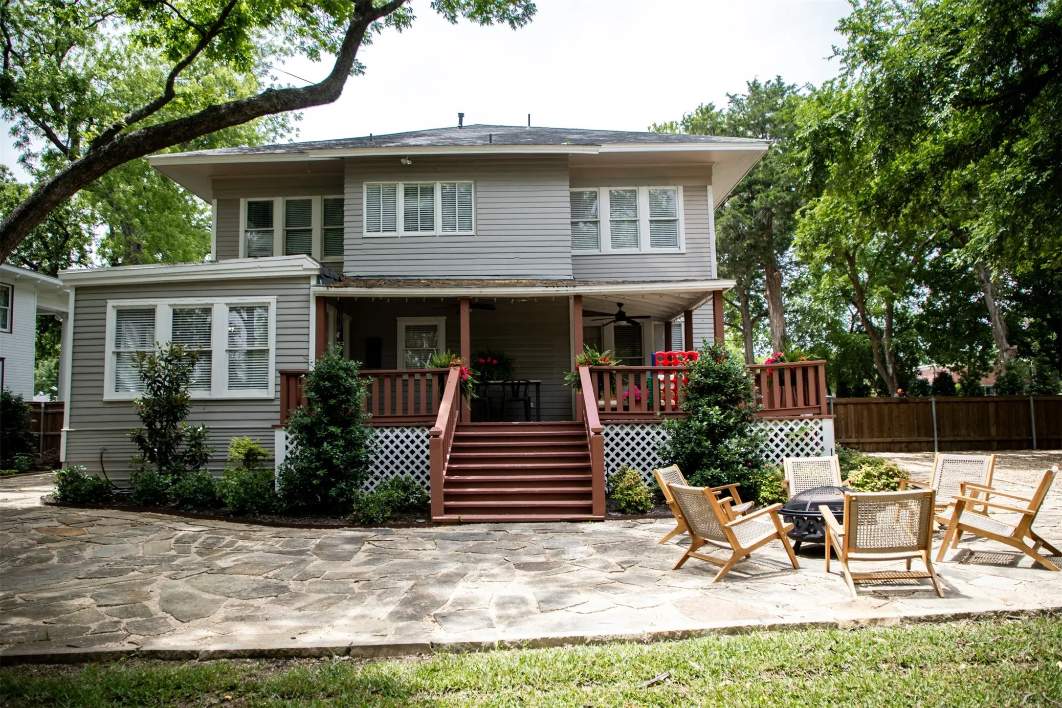 Gray siding exterior with multiple windows