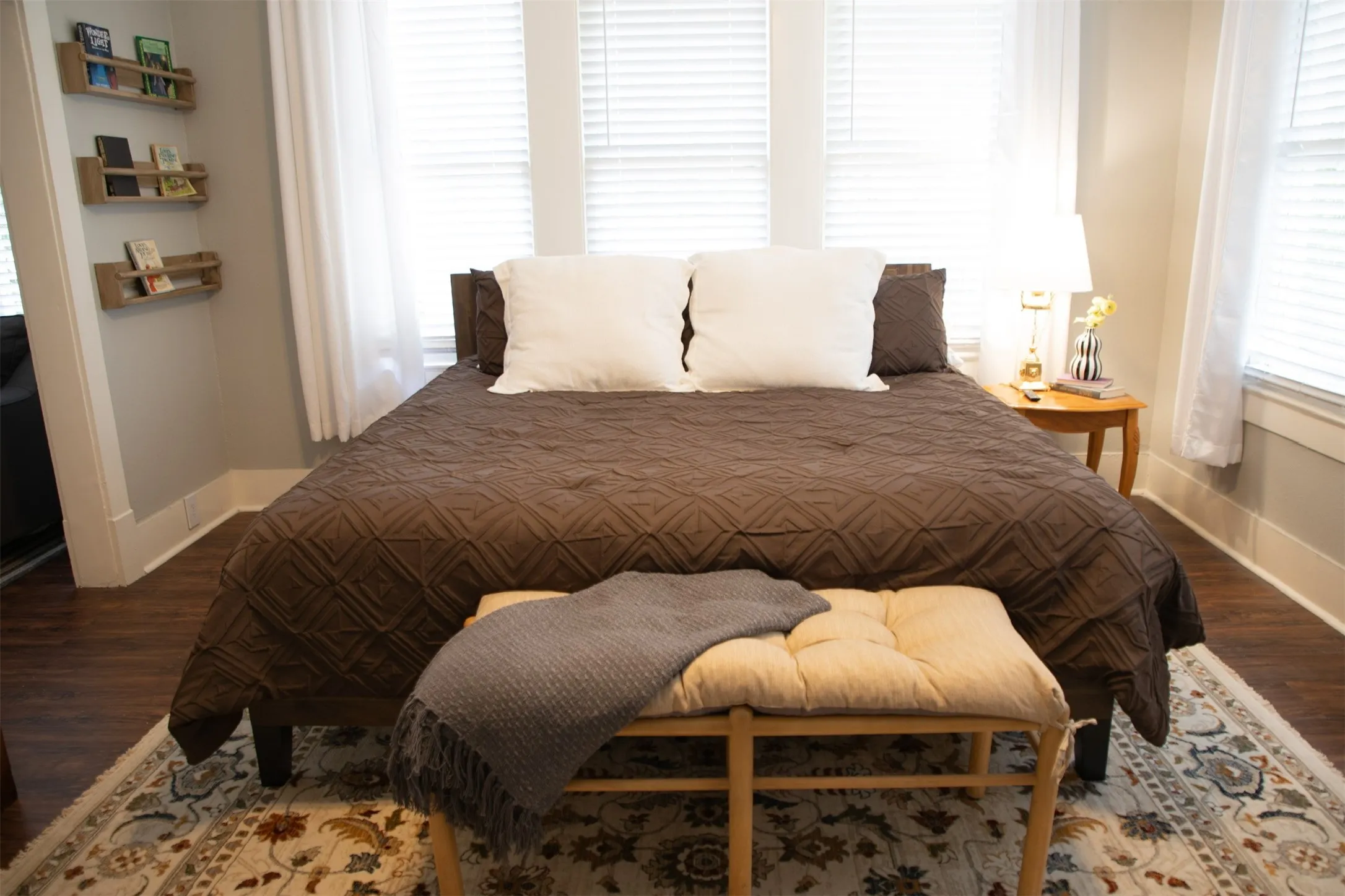 Wood-finish flooring with a decorative area rug