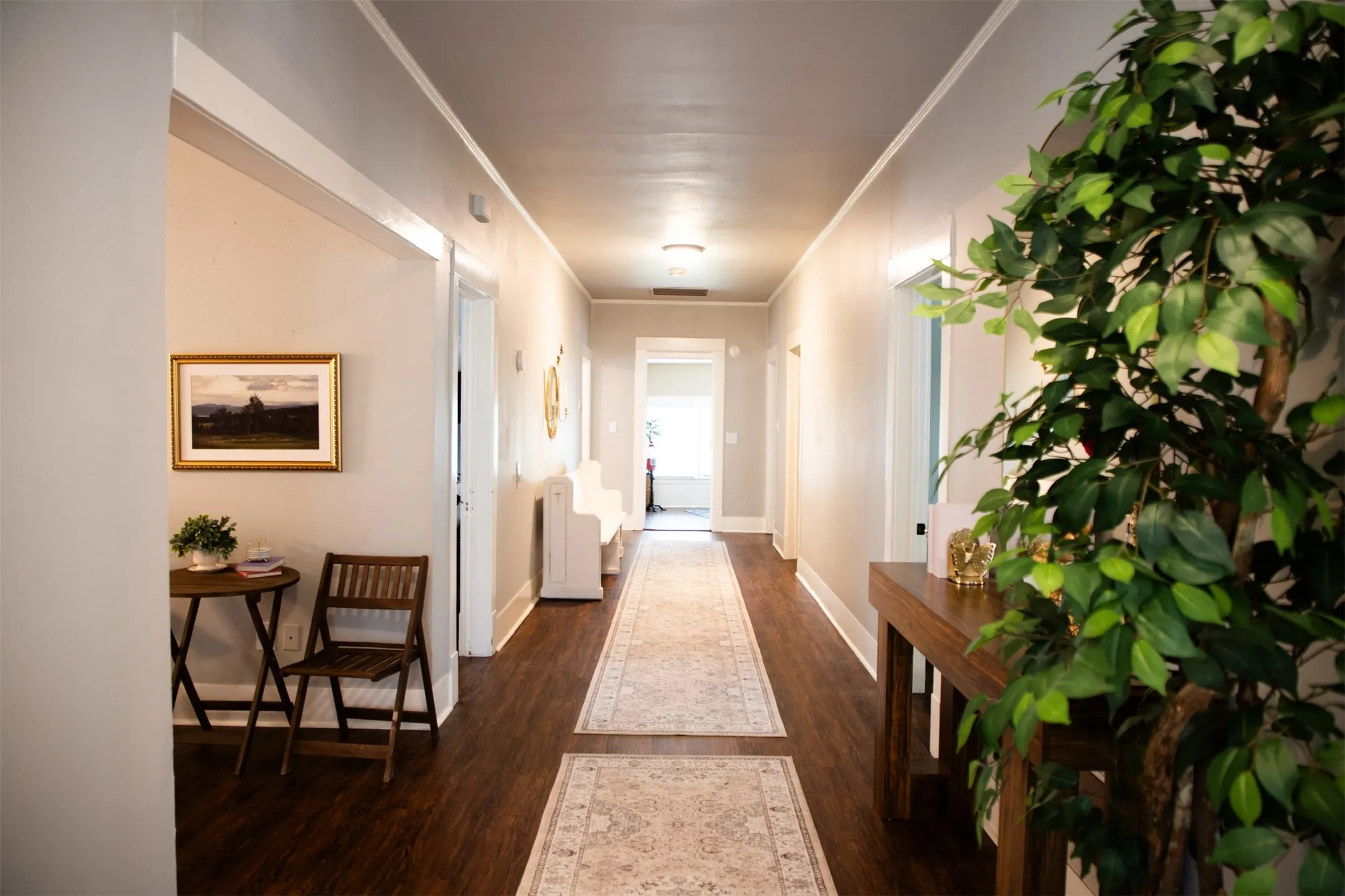 Hallway featuring wood-finish flooring, light neutral wall tones, and recessed lighting