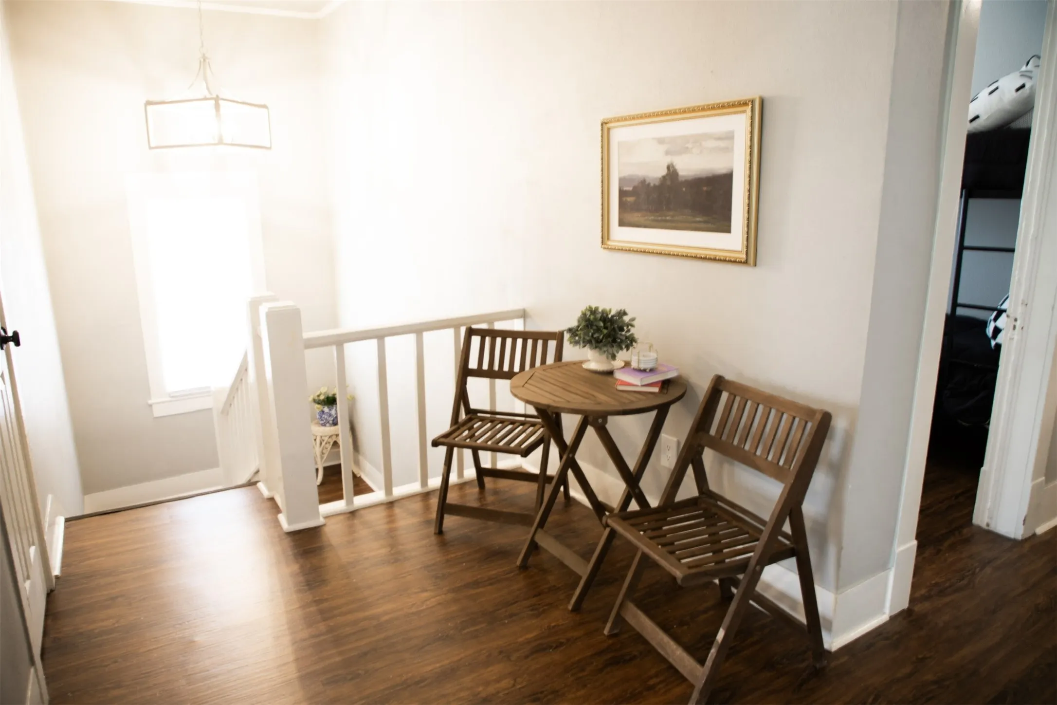 Wood-finish flooring throughout the hallway