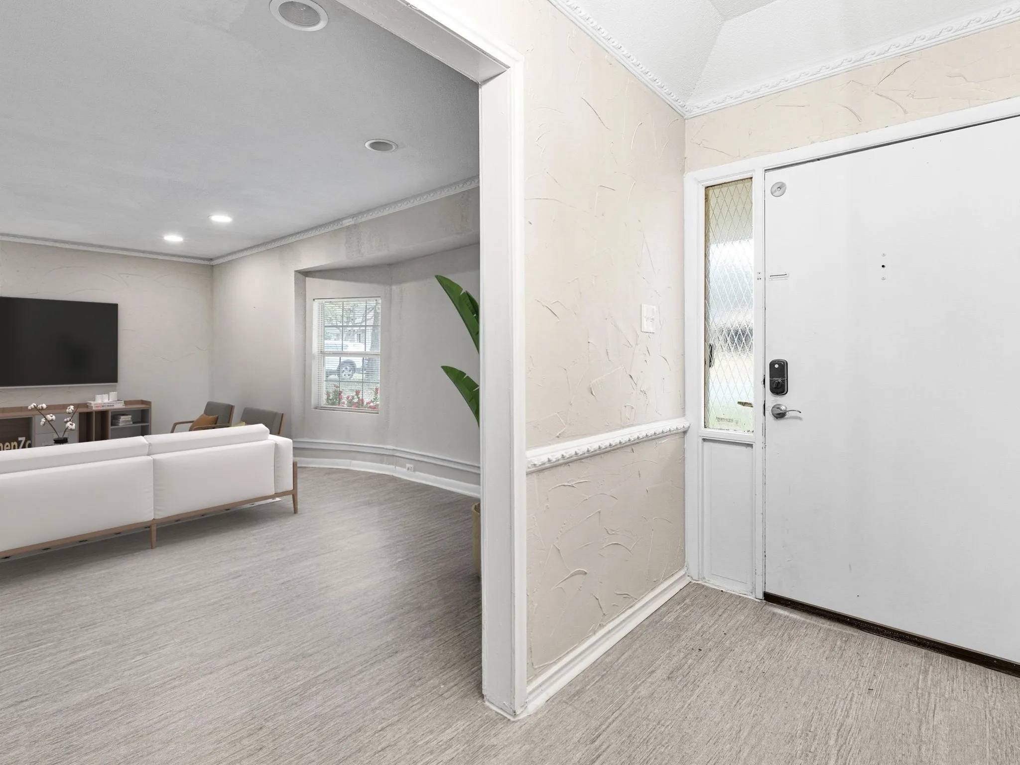 Recessed lighting, crown molding, wood-finish flooring, textured wall finish, and a bay window