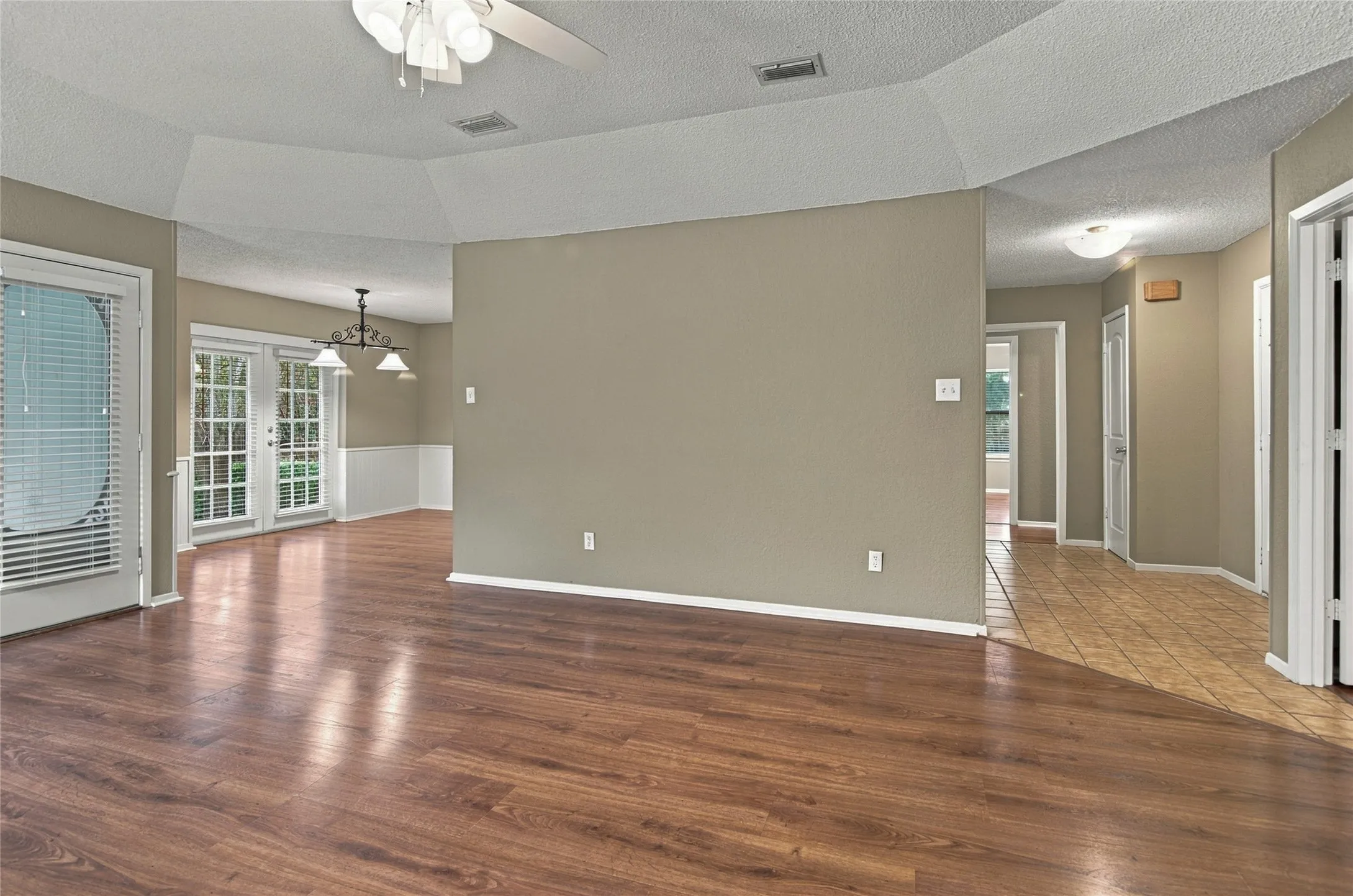 LVP flooring flows from the living room to the dining space