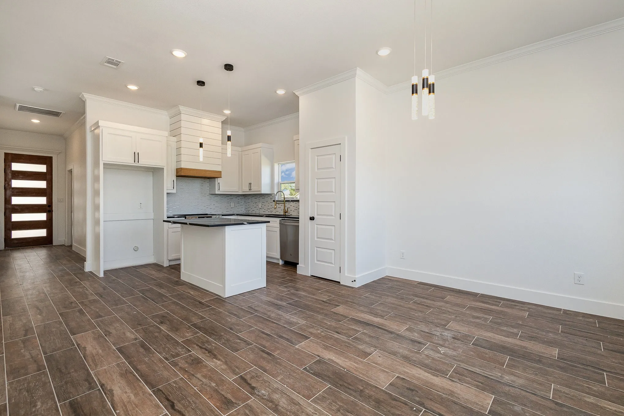 Looking towards kitchen & entry from dining room.