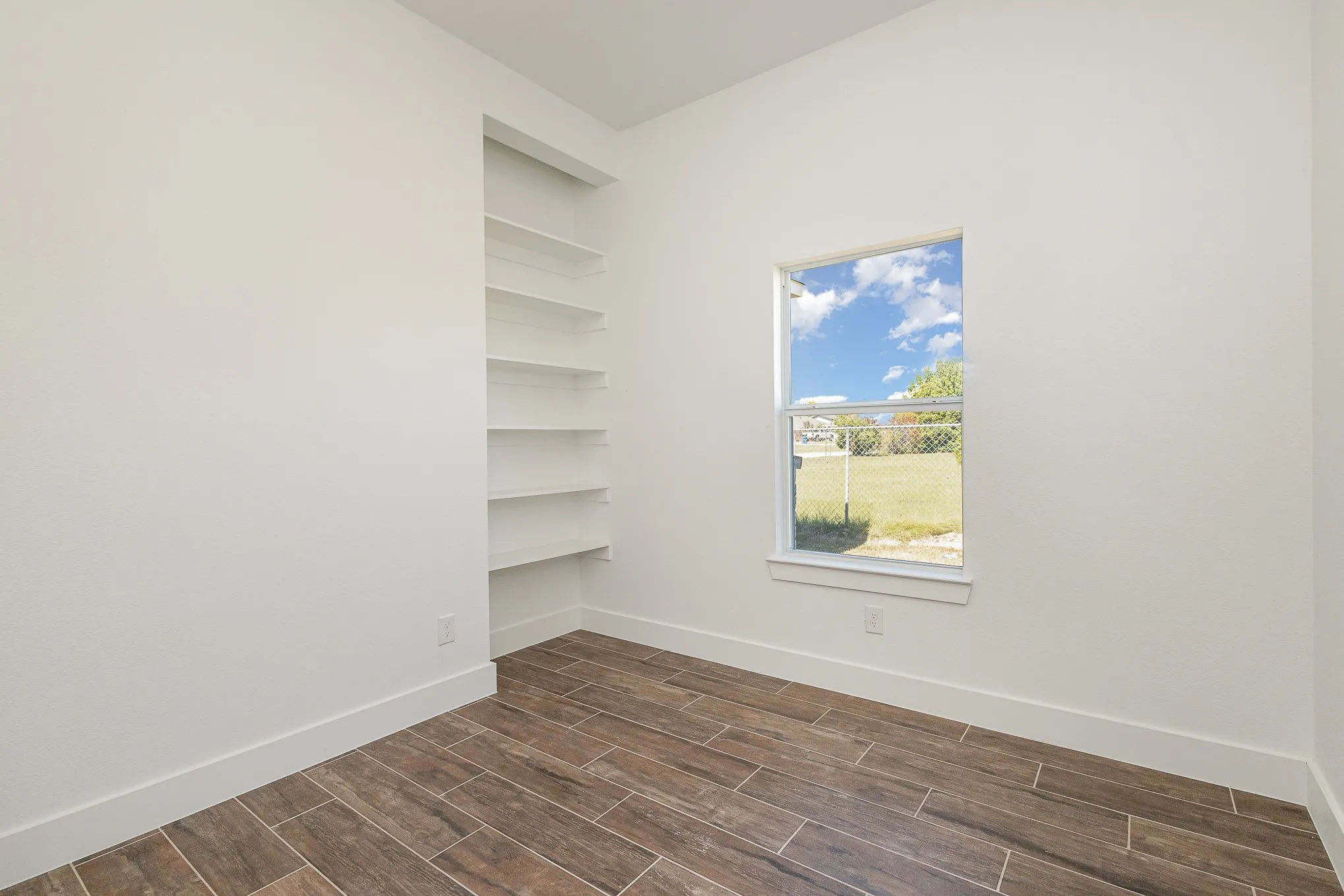 or flex room with built-in shelving