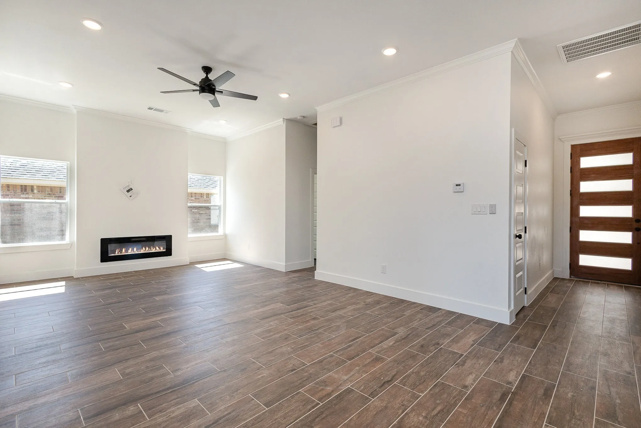 Large living space with fireplace.