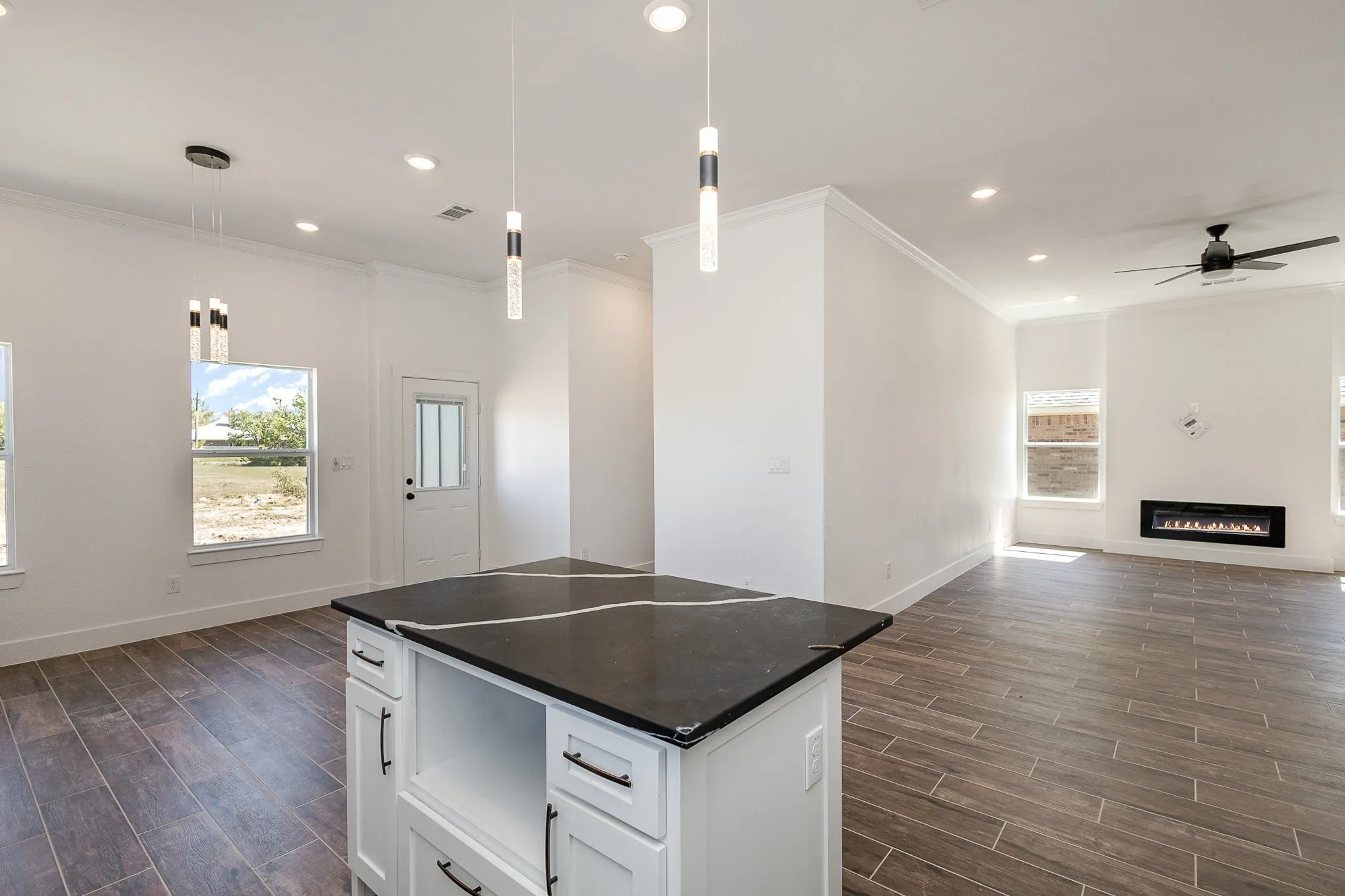 Dining to the left and full view of living room with fireplace