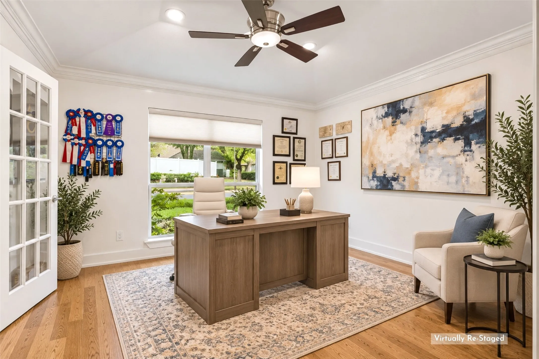 Private Office with Room to Focus — A generous footprint, large front-facing window, hardwood flooring, and French-door access create a bright workspace with enough separation for focused work or quiet reading.