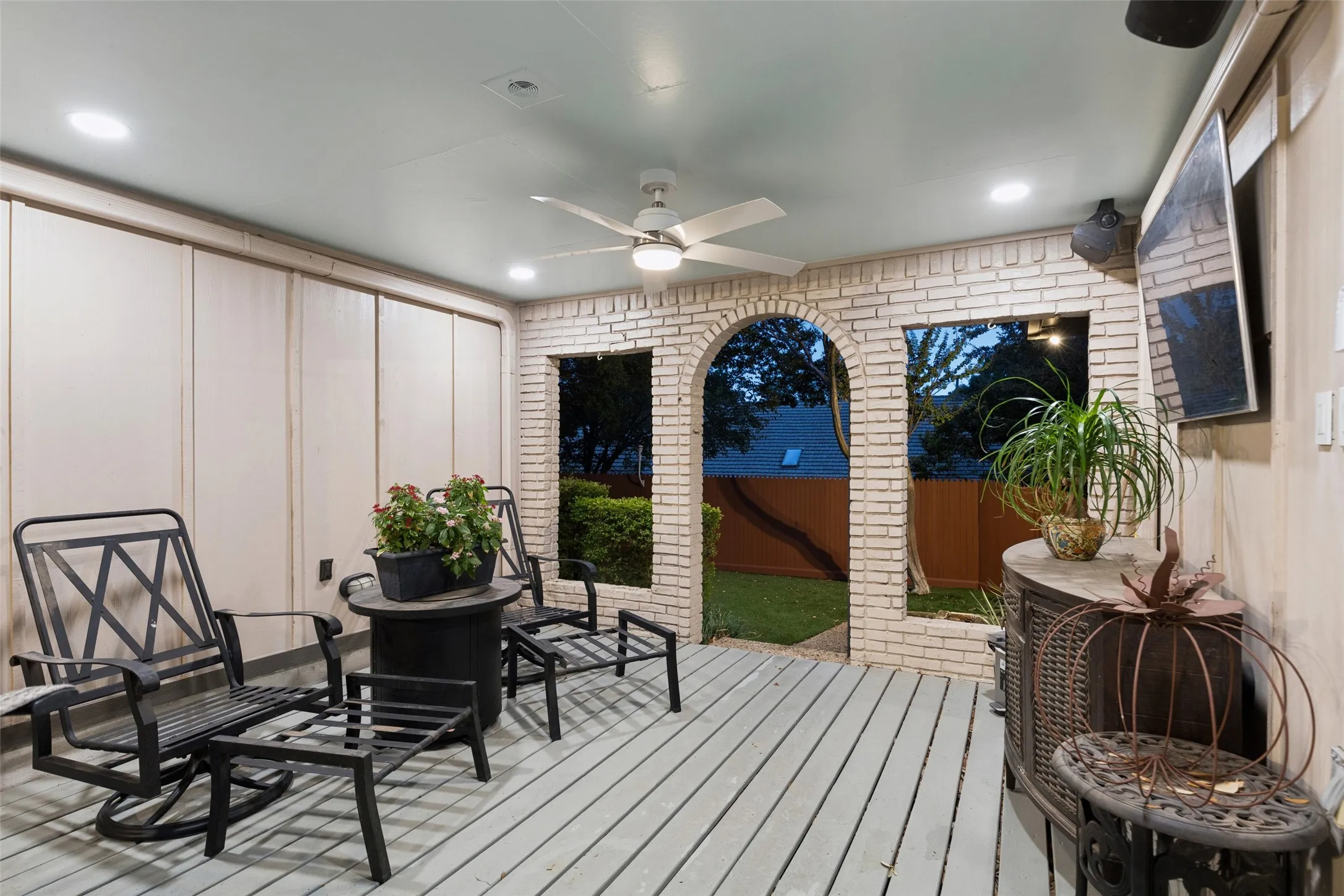 Architectural Detail in the Covered Patio — Brick arches give the covered outdoor area added character while framing views of the yard and creating a comfortable place to relax outside.