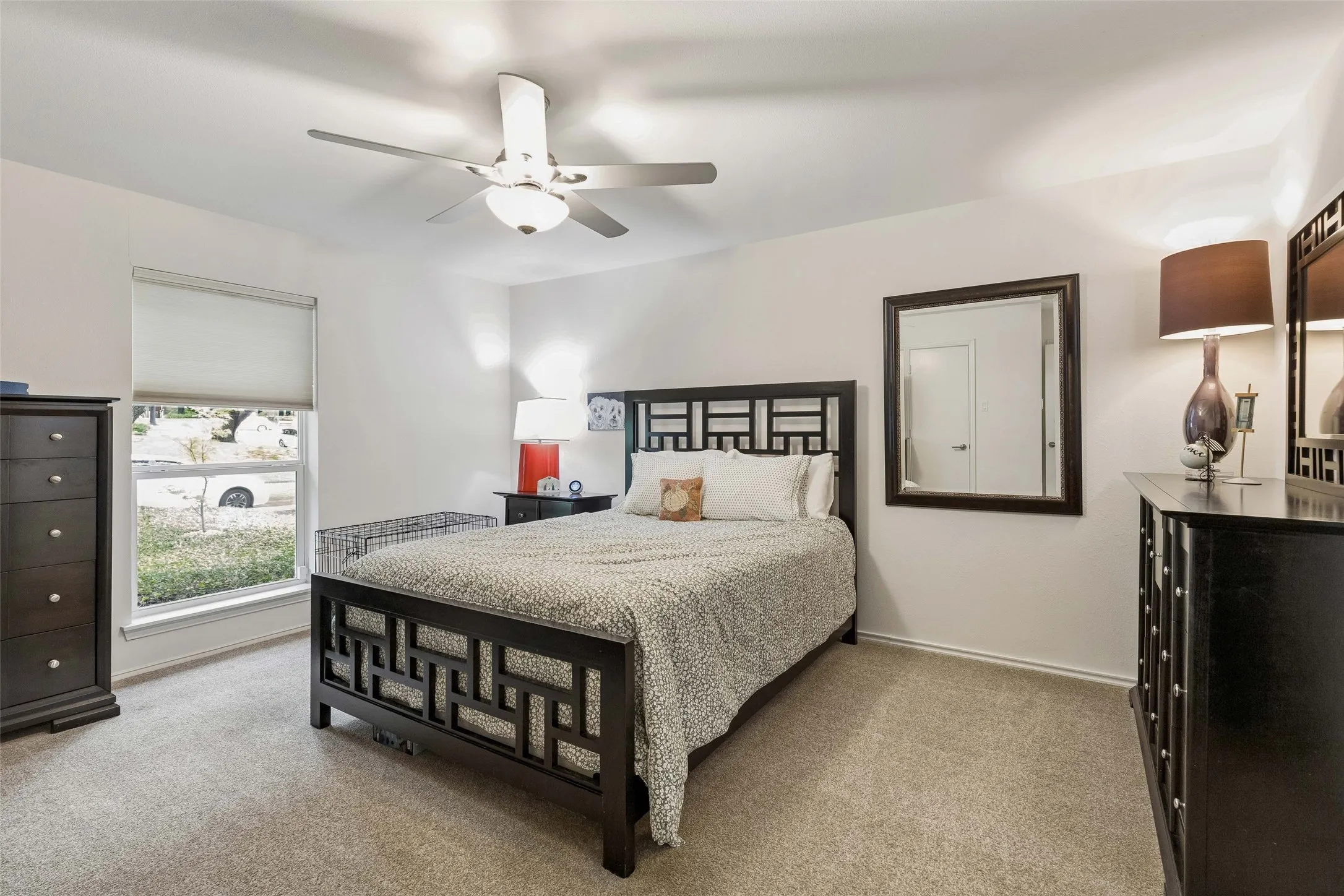 Spacious Third Bedroom - This well-proportioned bedroom offers updated carpeting, a ceiling fan, and a large window that brings in natural light while leaving plenty of room for everyday comfort.
