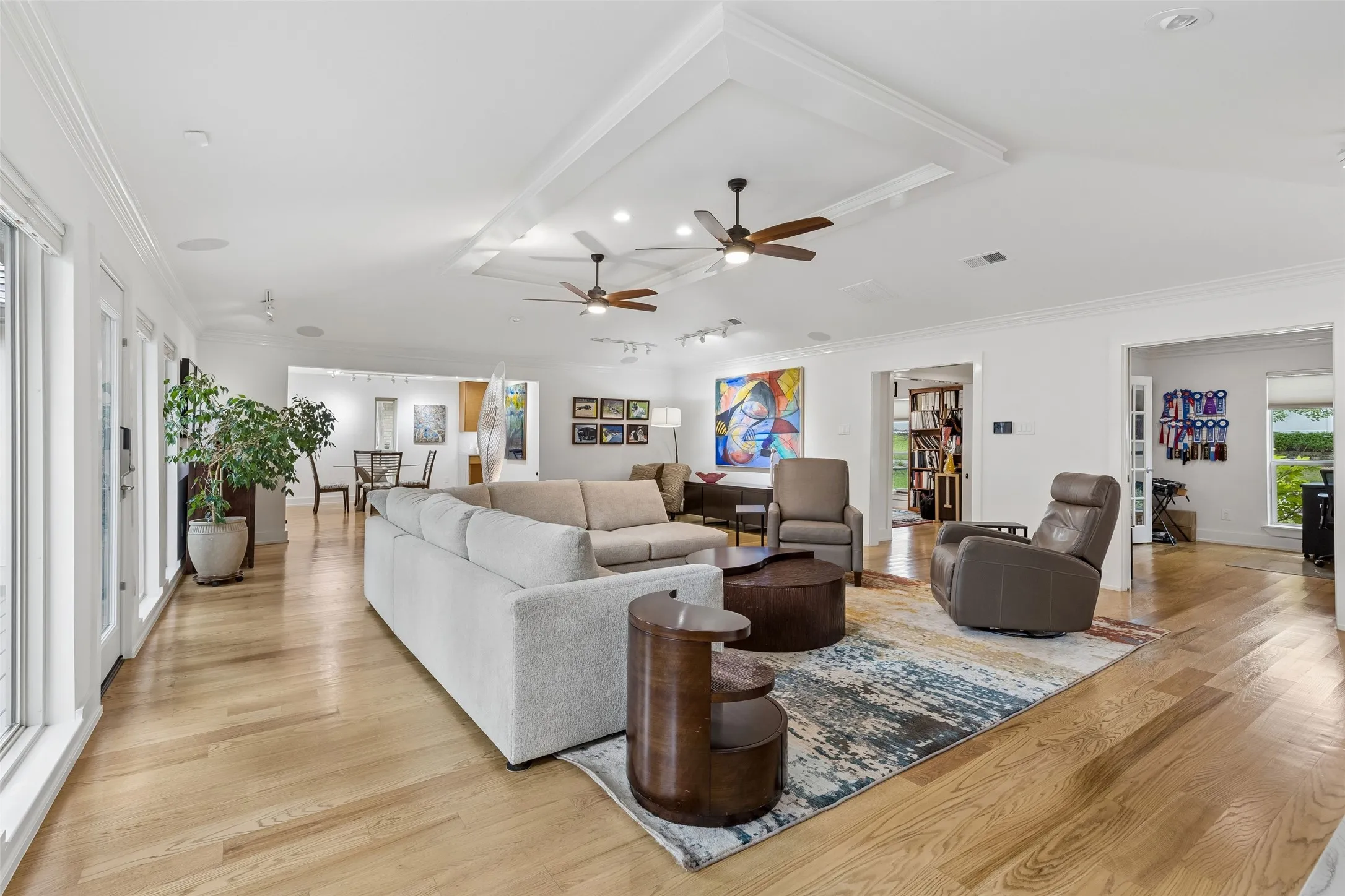 Connected Living with Flexible Flow — This wide-angle view shows how the main living area connects naturally to adjacent rooms, creating an open, easy-to-navigate layout with multiple pathways for everyday living and entertaining.