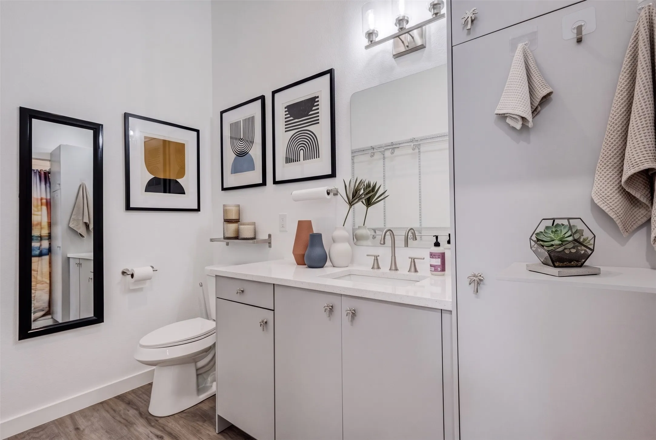 Vanity with integrated sink, light gray cabinetry, and brushed nickel hardware - AI Generated