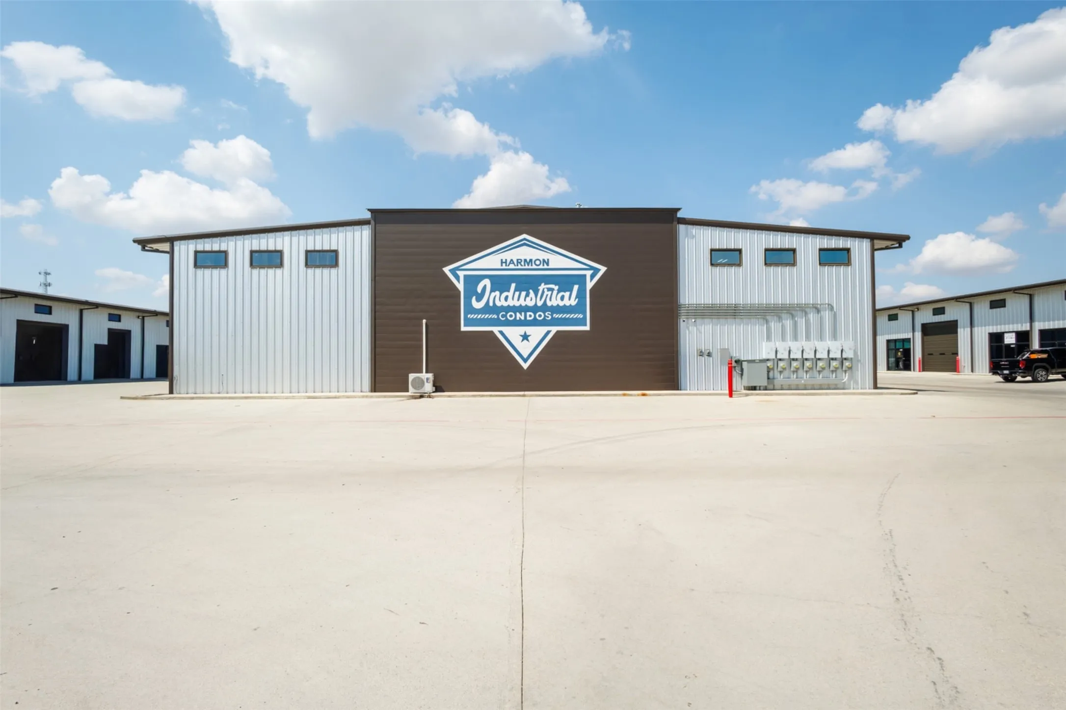 Modern industrial-style facade featuring horizontal siding and corrugated metal panels