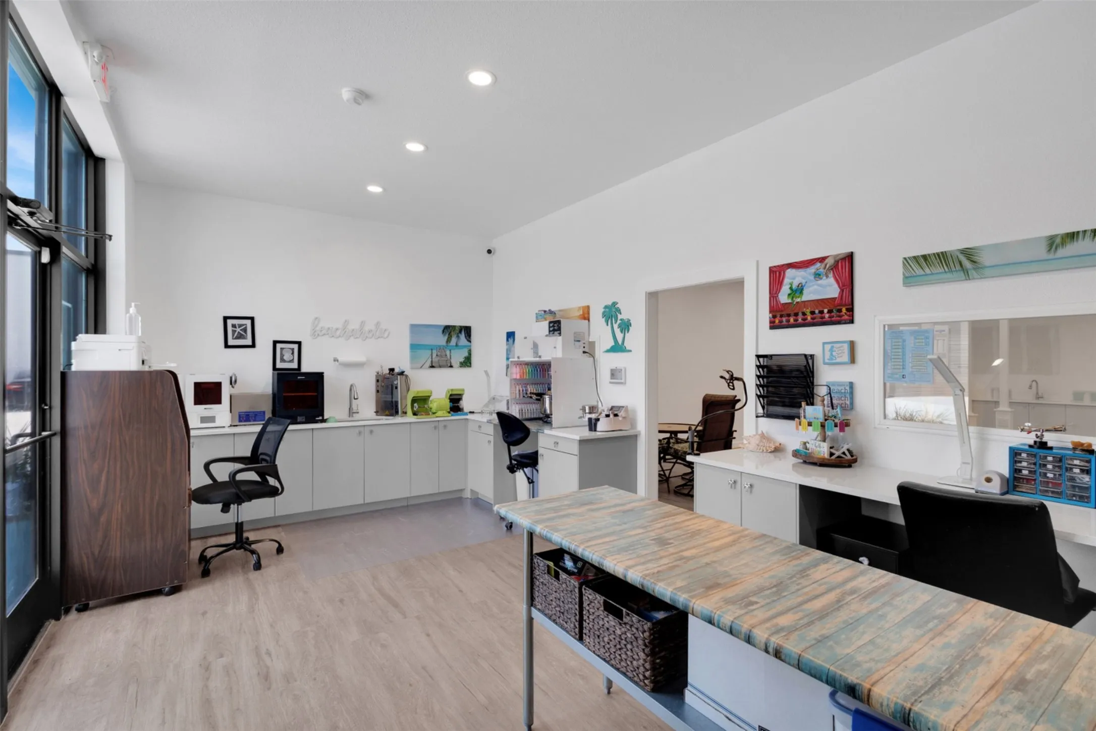 Wood-finish flooring, recessed lighting, and expansive windows - AI
