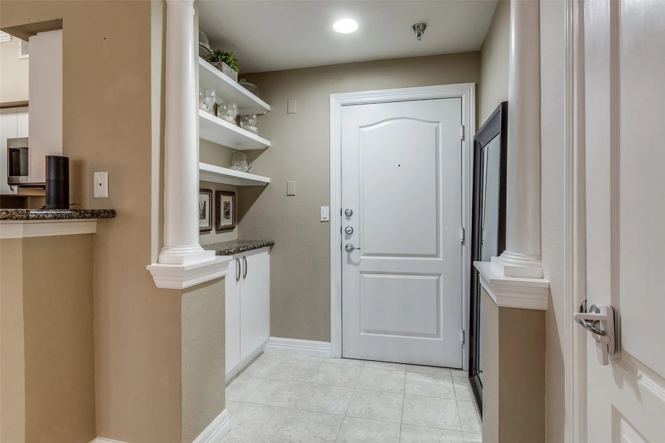 Entryway with lovely shelving & storage
