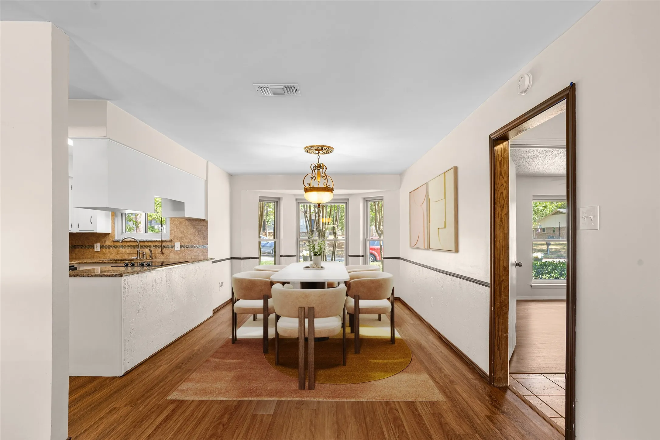 Wood-finish flooring throughout the dining area