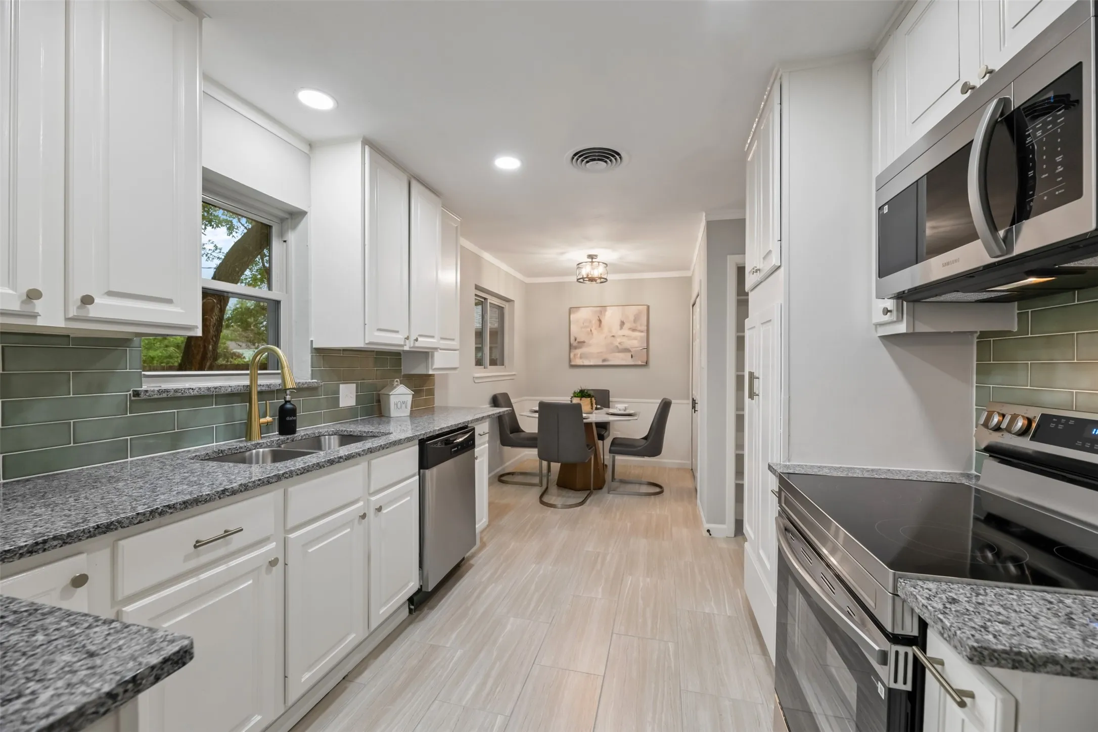 Kitchen has new granite, stainless appliances, and back splash