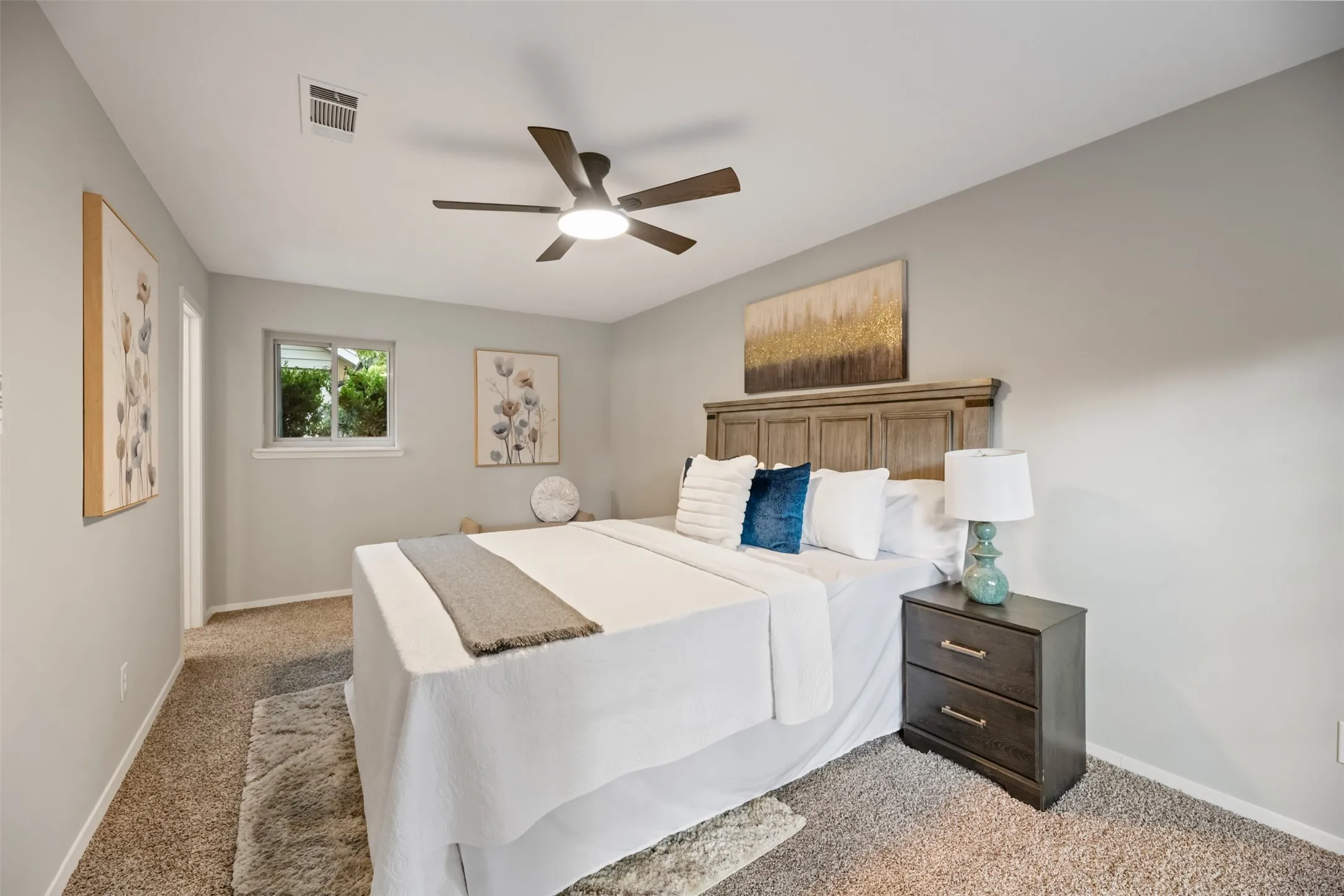 Primary bedroom.  All bedrooms have new fans and carpet.