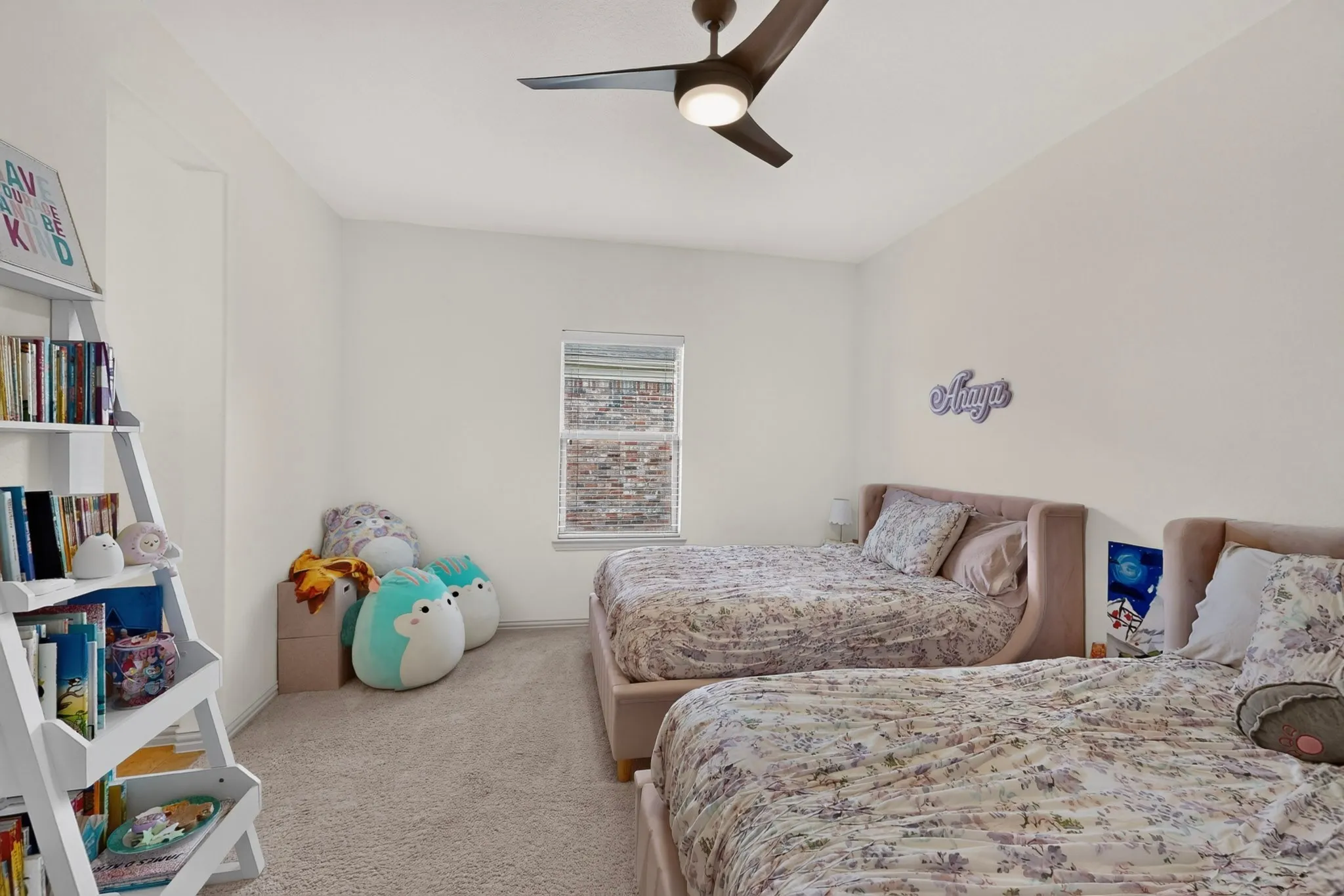 Recessed window, ceiling fan, and light-toned wall finishes