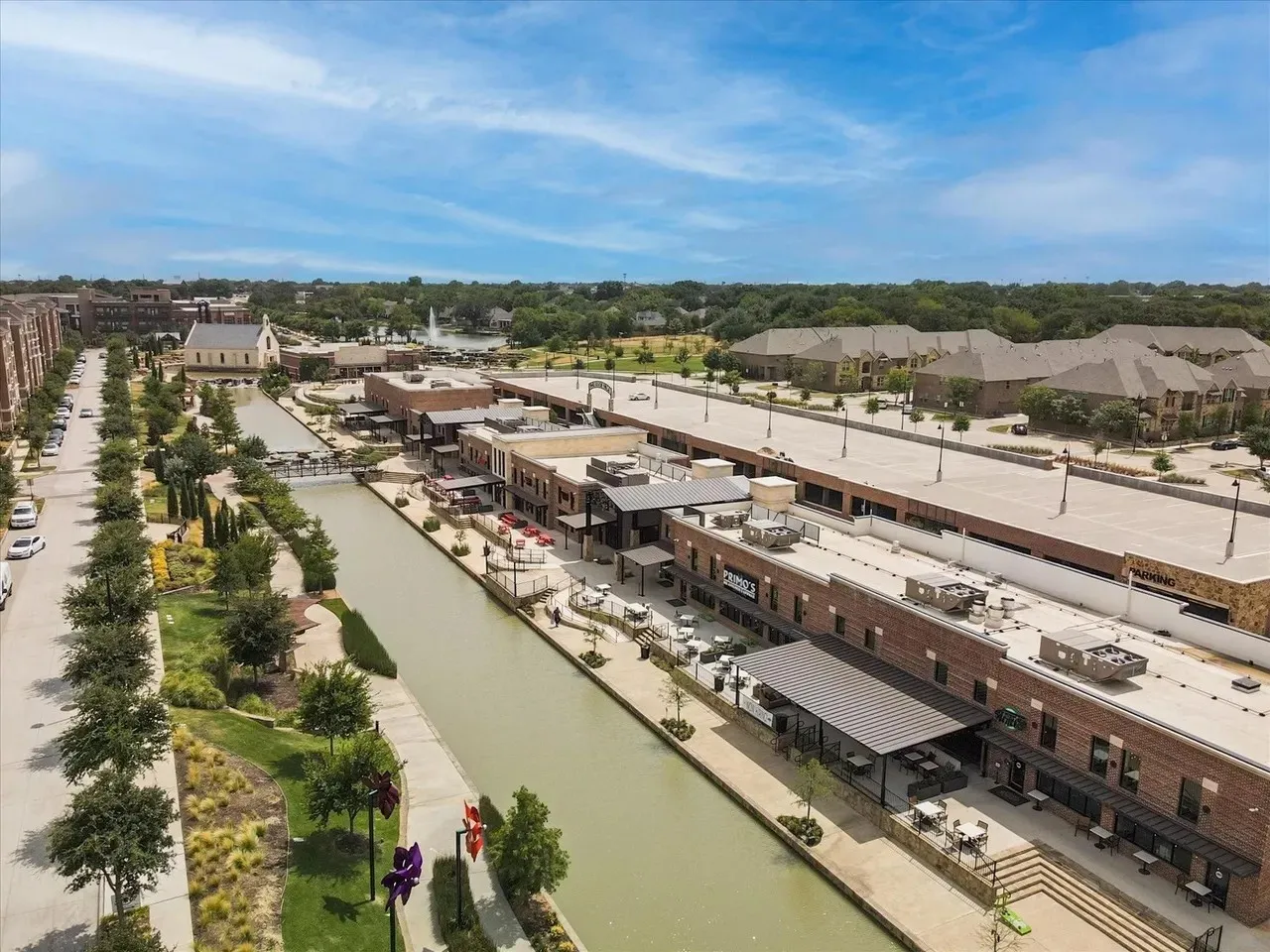 Waterfront retail and residential development with dedicated parking structures