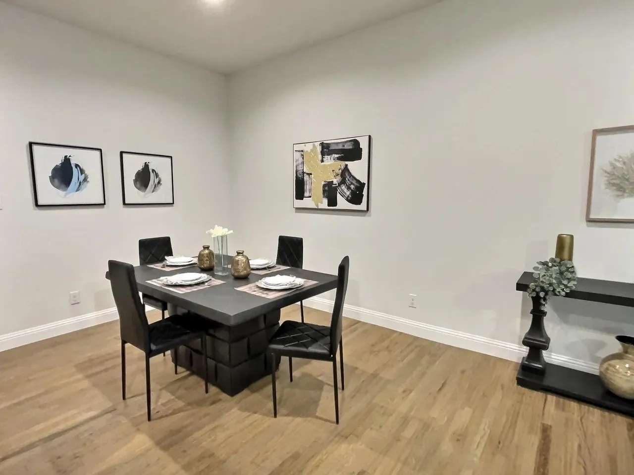 Hardwood-finish flooring, recessed lighting, and crisp white walls