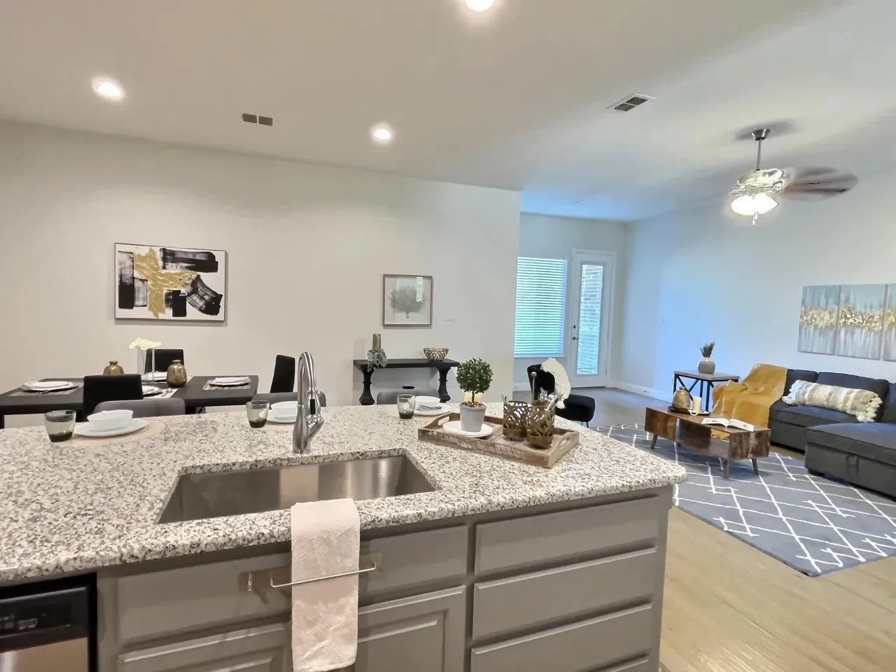 Kitchen island with granite countertop and undermount stainless steel sink