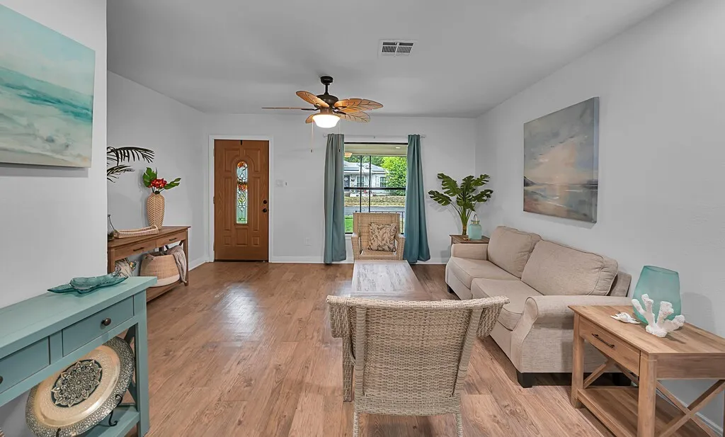 Warm wood-finish flooring complements the neutral wall tones throughout