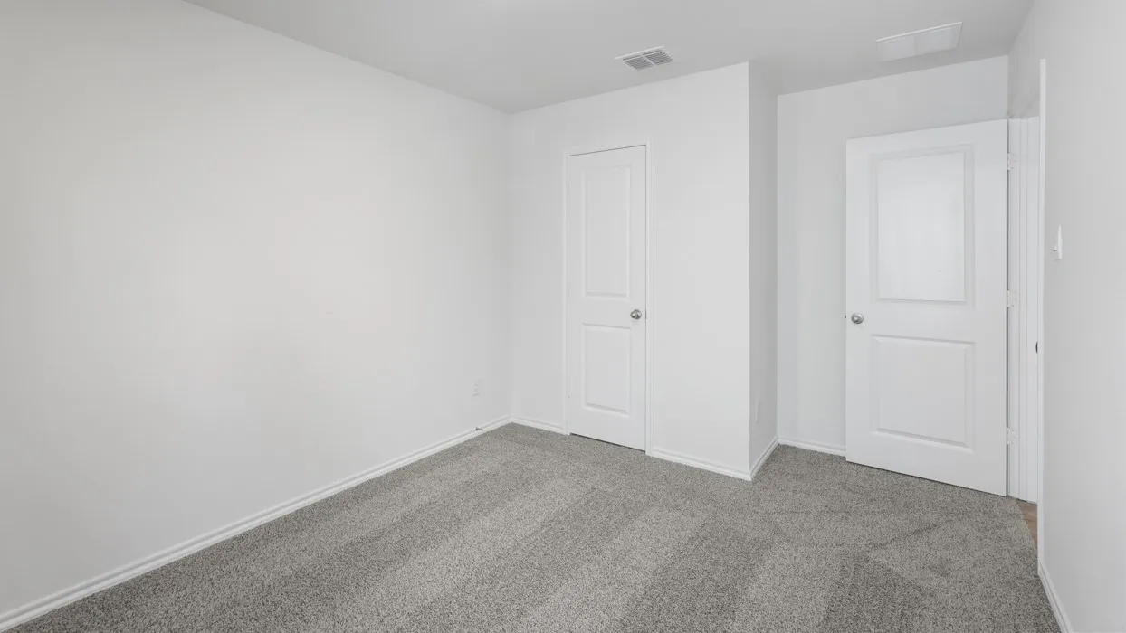 Neutral wall finishes and gray carpet flooring
