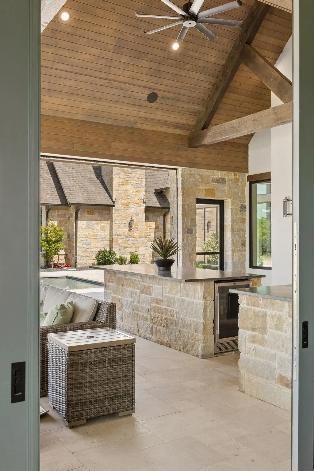 Sliding doors from the game room to the outdoor living space