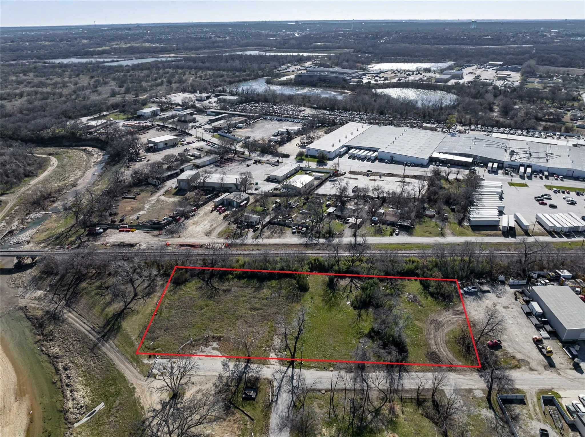 Aerial view of property's location with an industrial area and property boundaries highlighted