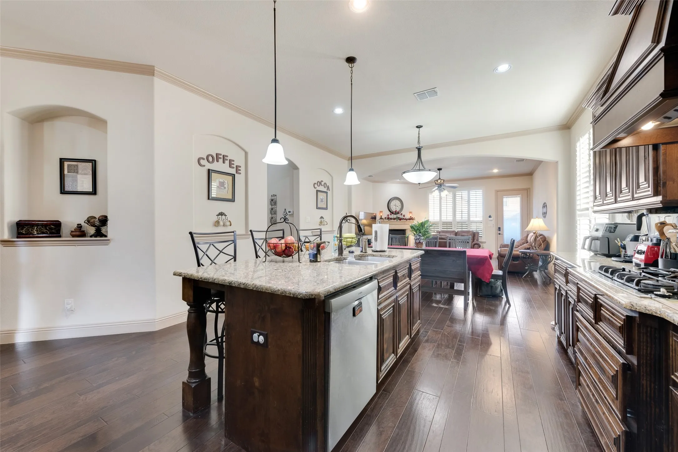 Large kitchen breakfast bar  and a center island with sink