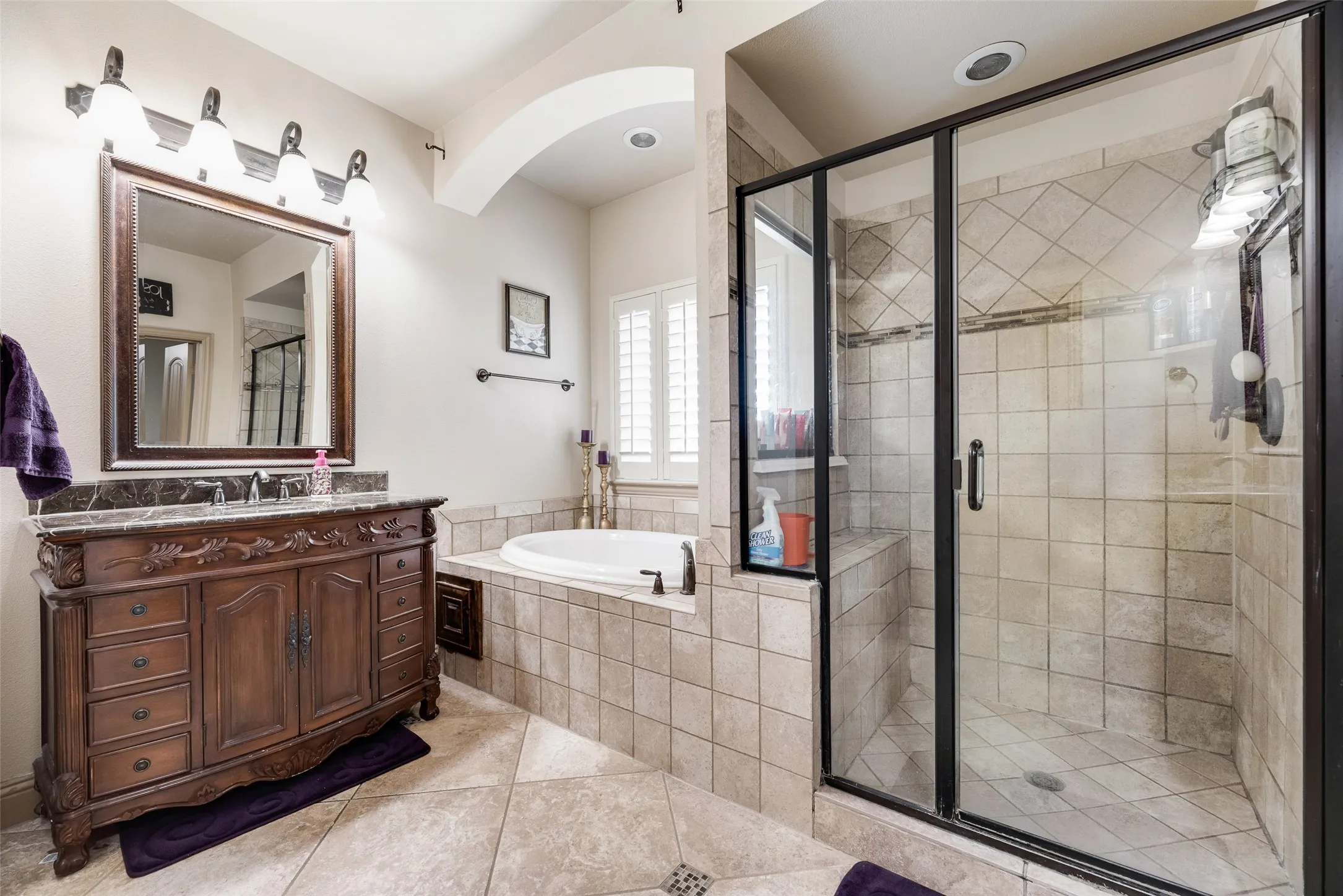 Primary Bathroom #3 featuring tile patterned walk in shower