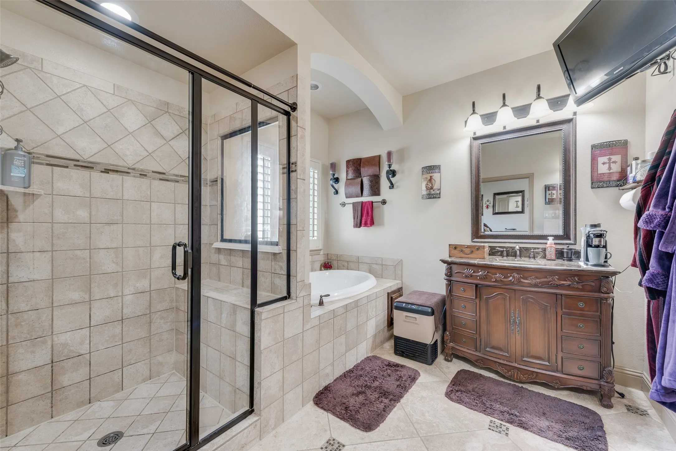 Main Primary Bathroom featuring vanity, shower with separate bathtub, and tile patterned flooring