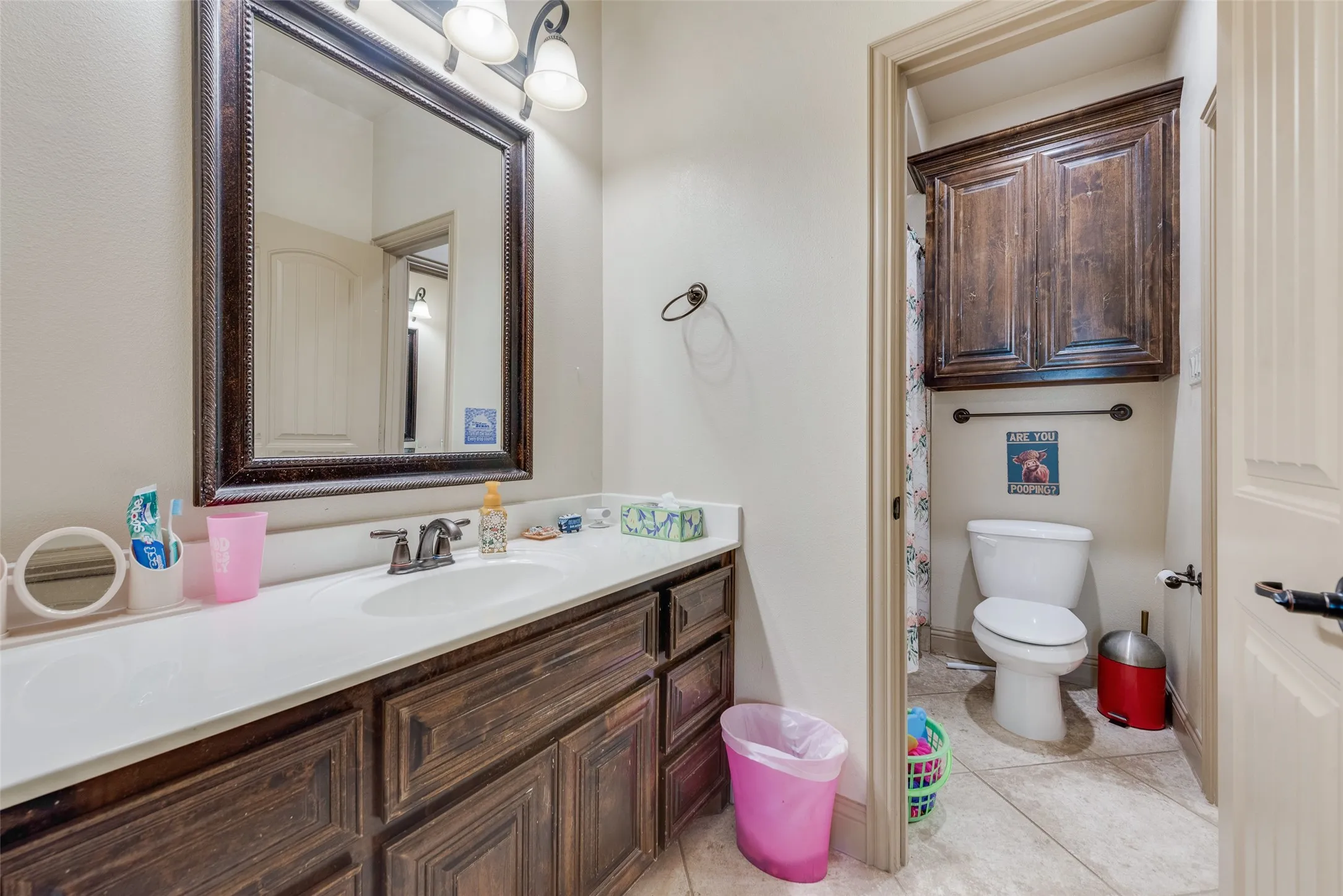 Bathroom # 5 Jack and Jill Bathroom with vanity, toilet, and tile patterned flooring