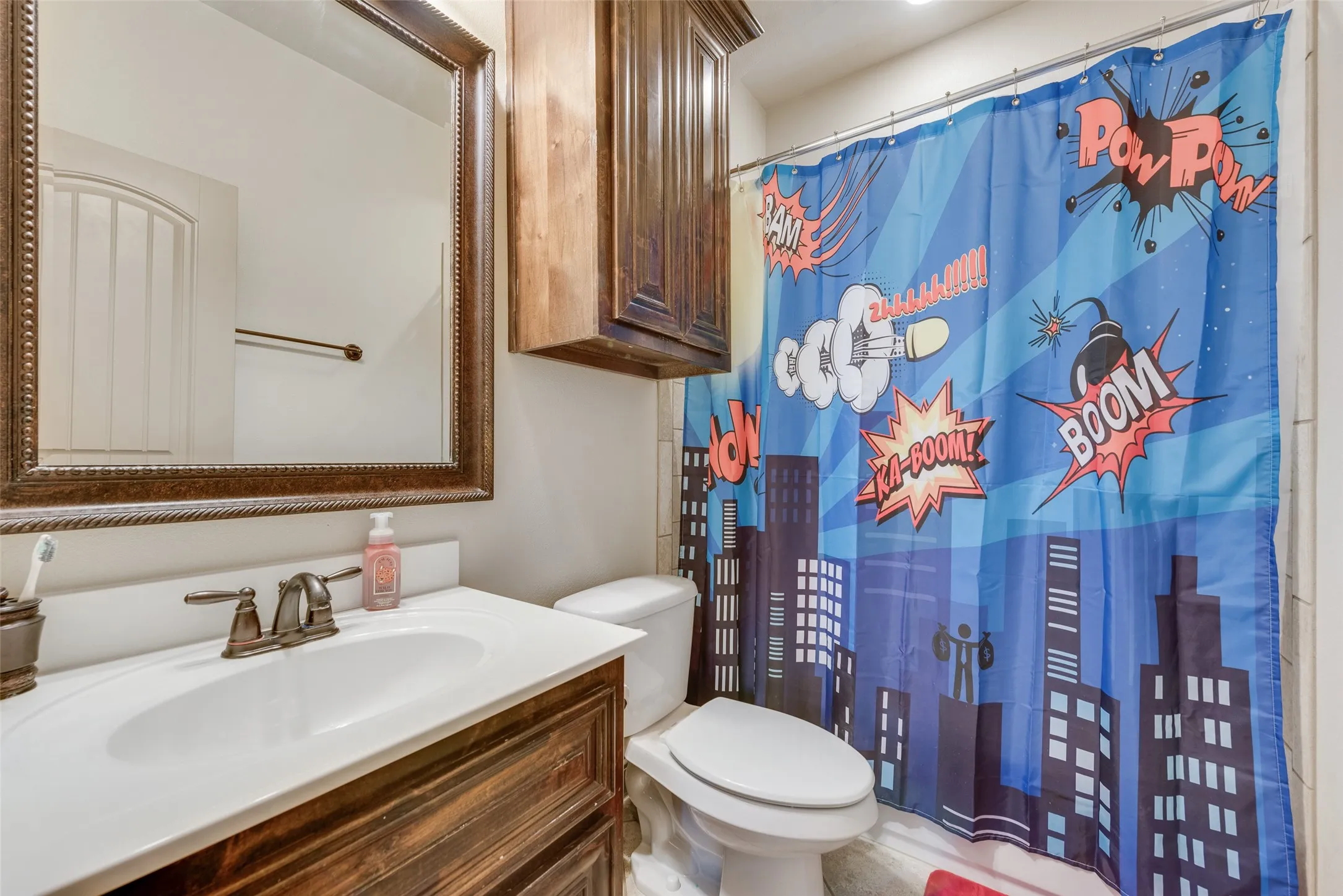 Bathroom #6 featuring walk in shower, vanity, and toilet
