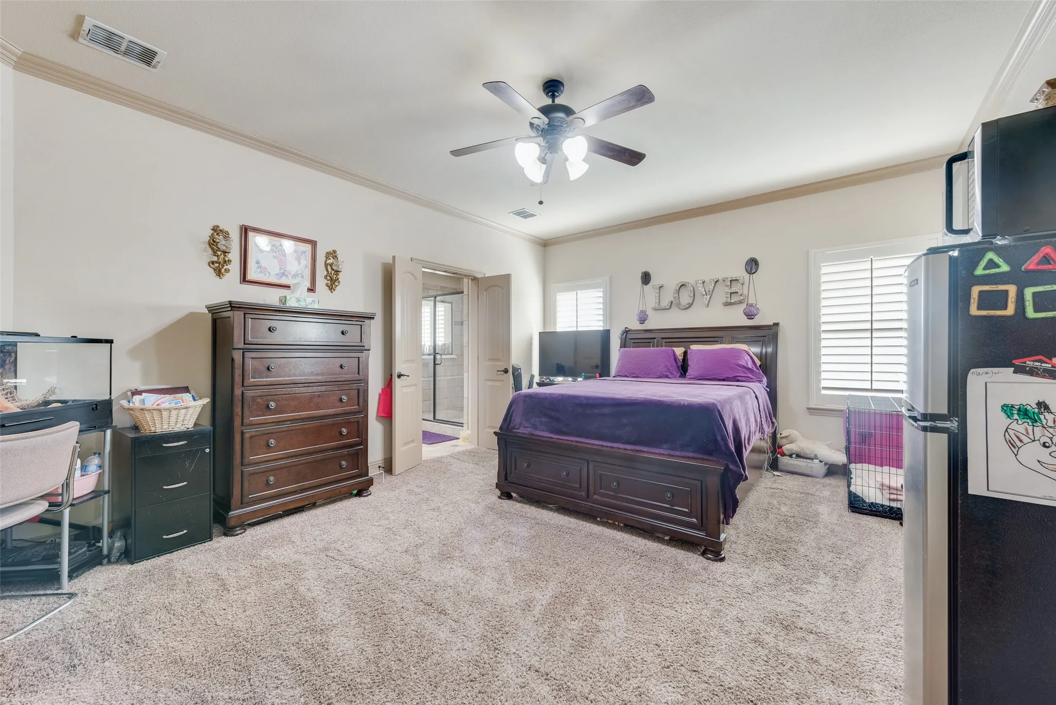 Primary Bedroom #3 with ceiling fan and crown molding