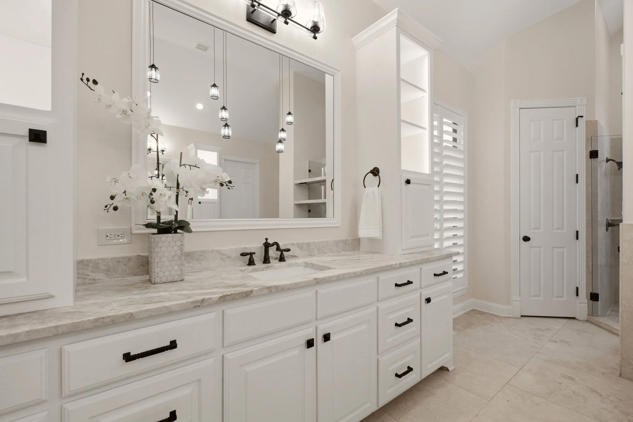 Equally impressive storage towers for your linens & toiletries. More Travertine floors.