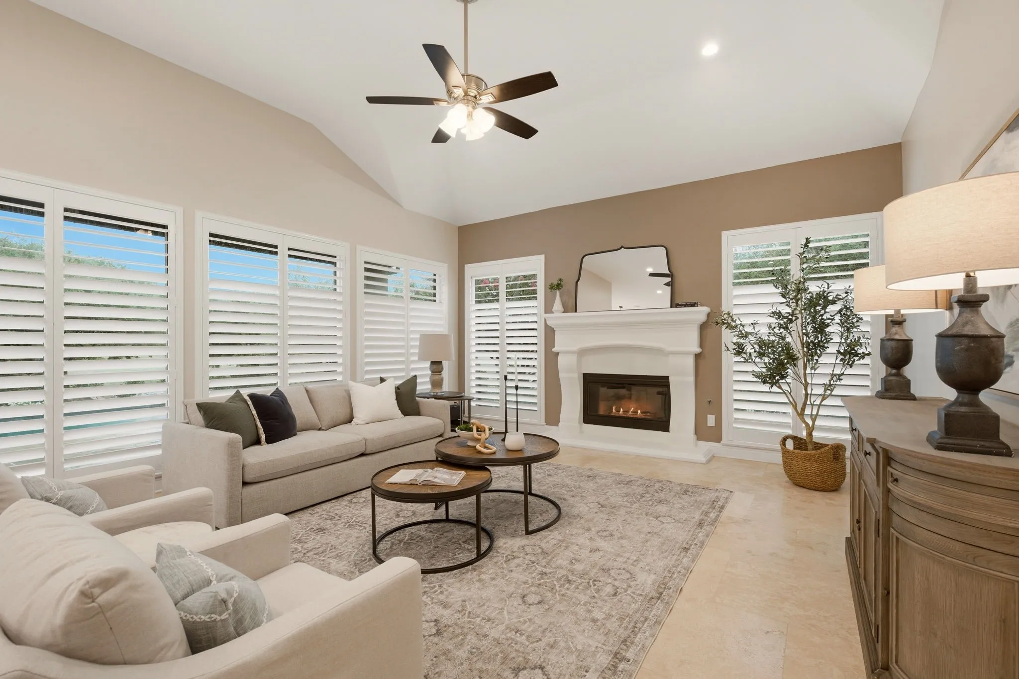 Everyone loves a comfortable, expansive family room ~ large enough for many furniture placement options for the family & friends to gather. Its focal point is the stone-encased gas log fireplace.