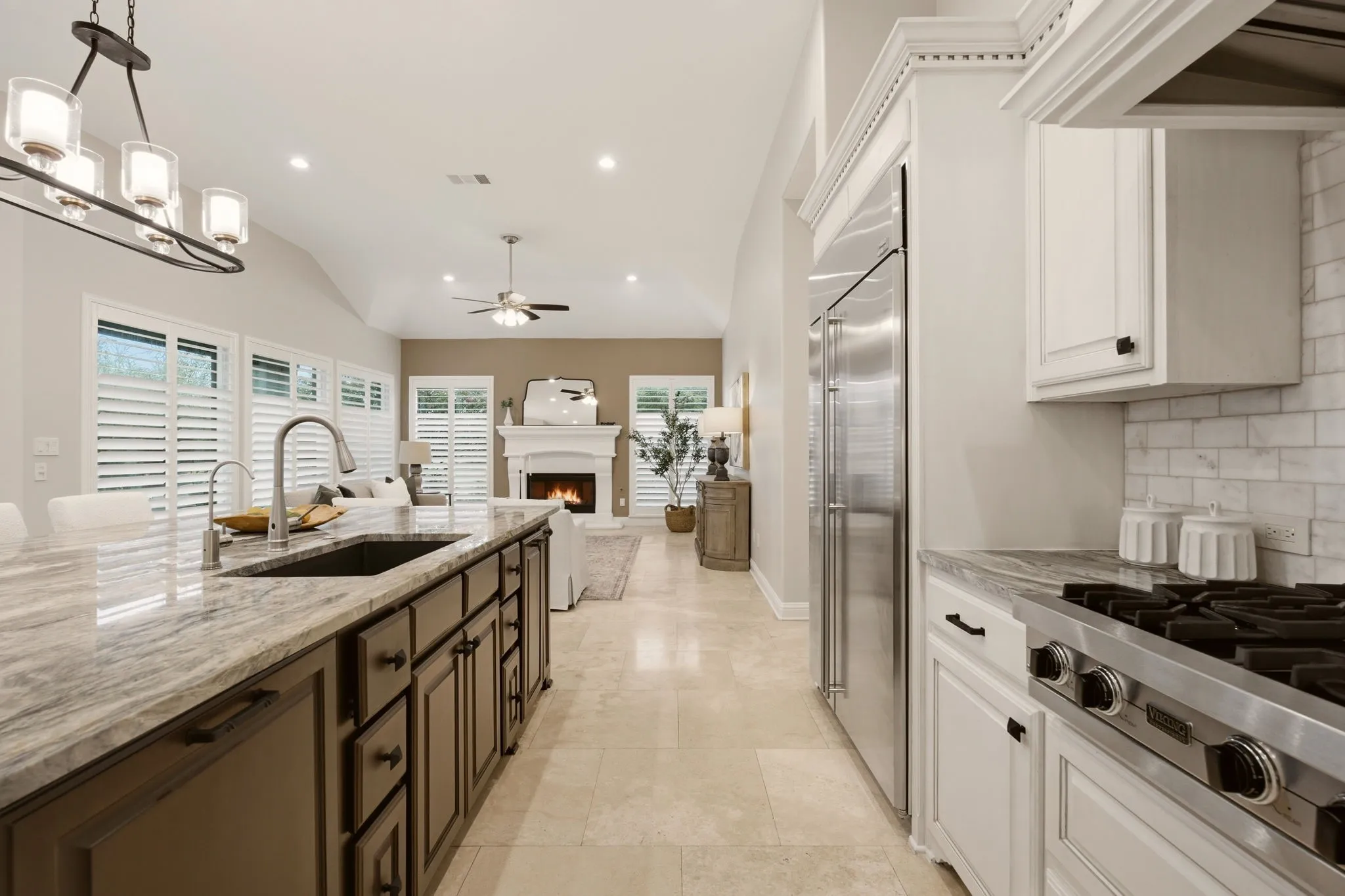 The kitchen remodel includes the addition of a trash drawer, vertical tray cupboard, the deep farm sink, reverse osmosis system installed + cabinet hardware.