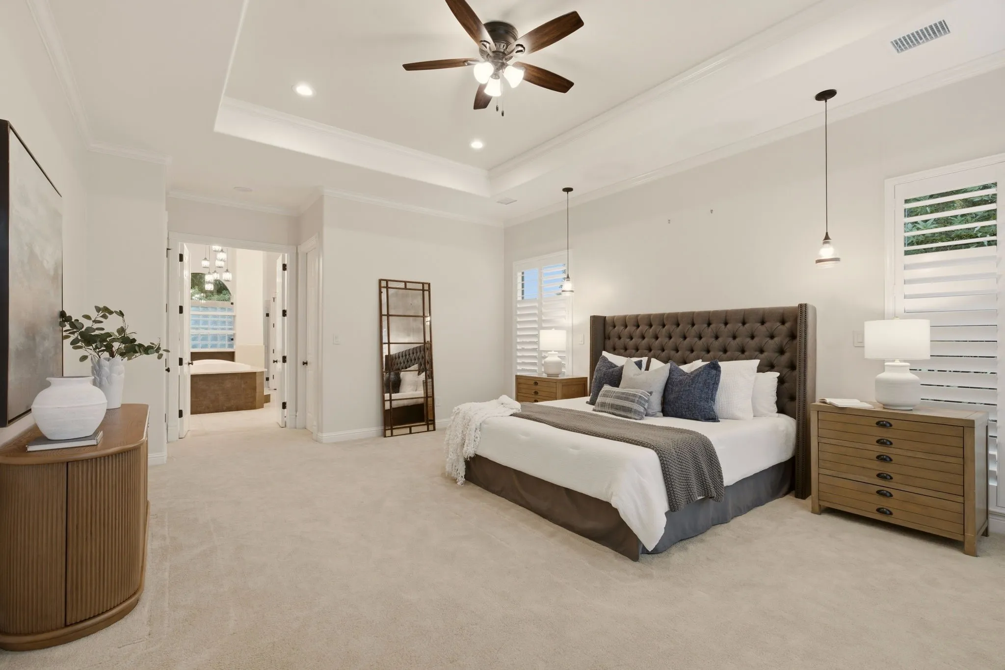 A seller favorite ~ this oversized primary bedroom is a true retreat! Large windows & double doors fill the space with natural light, creating a peaceful connection to the outdoor setting.