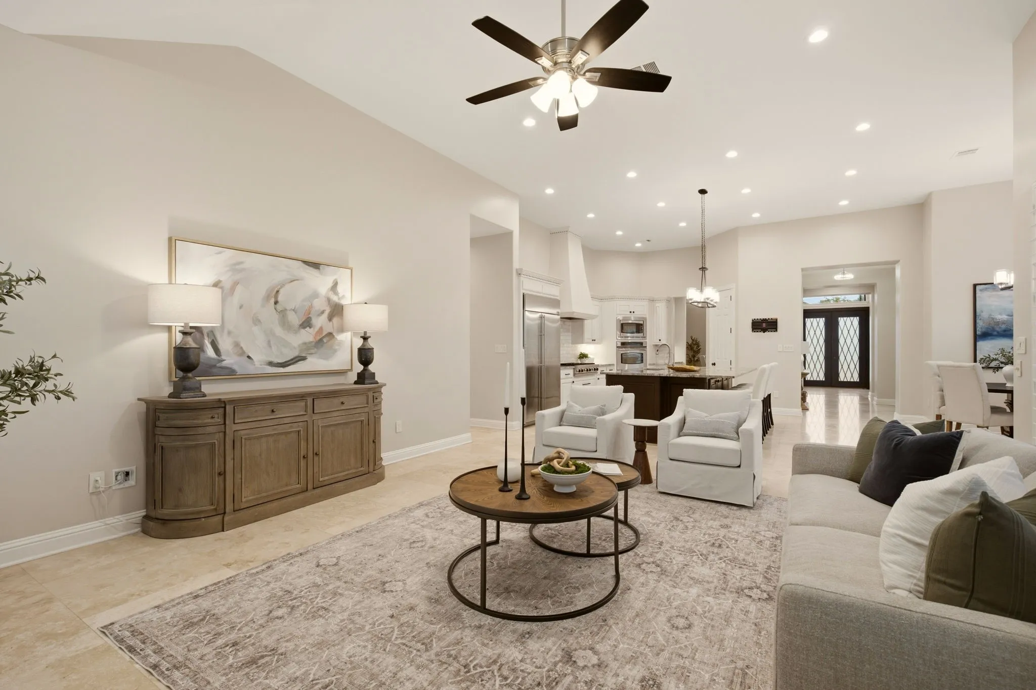 Neutral tone walls + elegant Travertine floors add warmth & timeless appeal while being durable & easy to maintain.