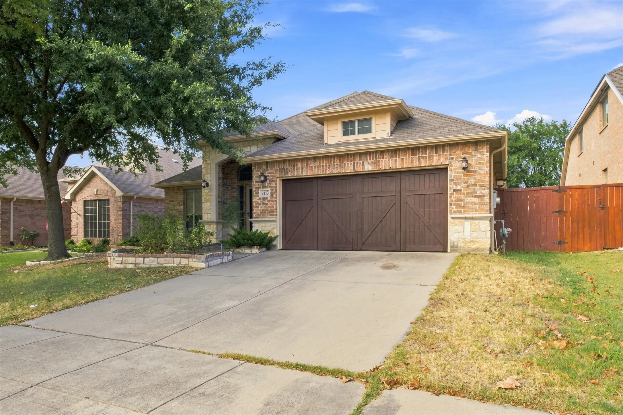 Brick and stone facade with a two-car garage